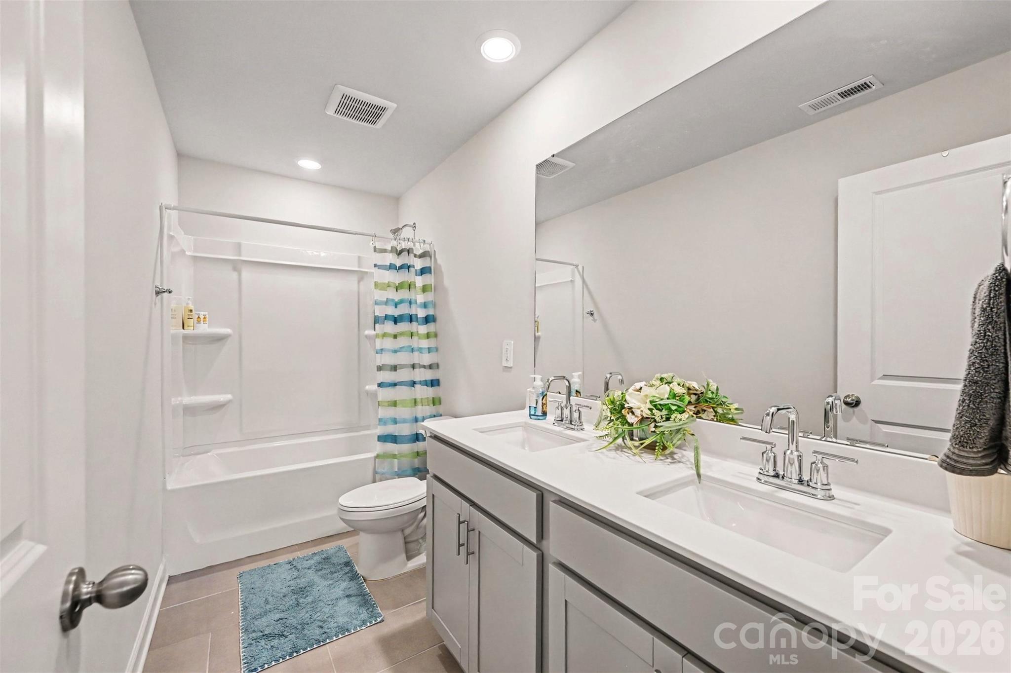 Three upstairs bedrooms share this full bathroom. - 408 Luna Lane, Shelby
