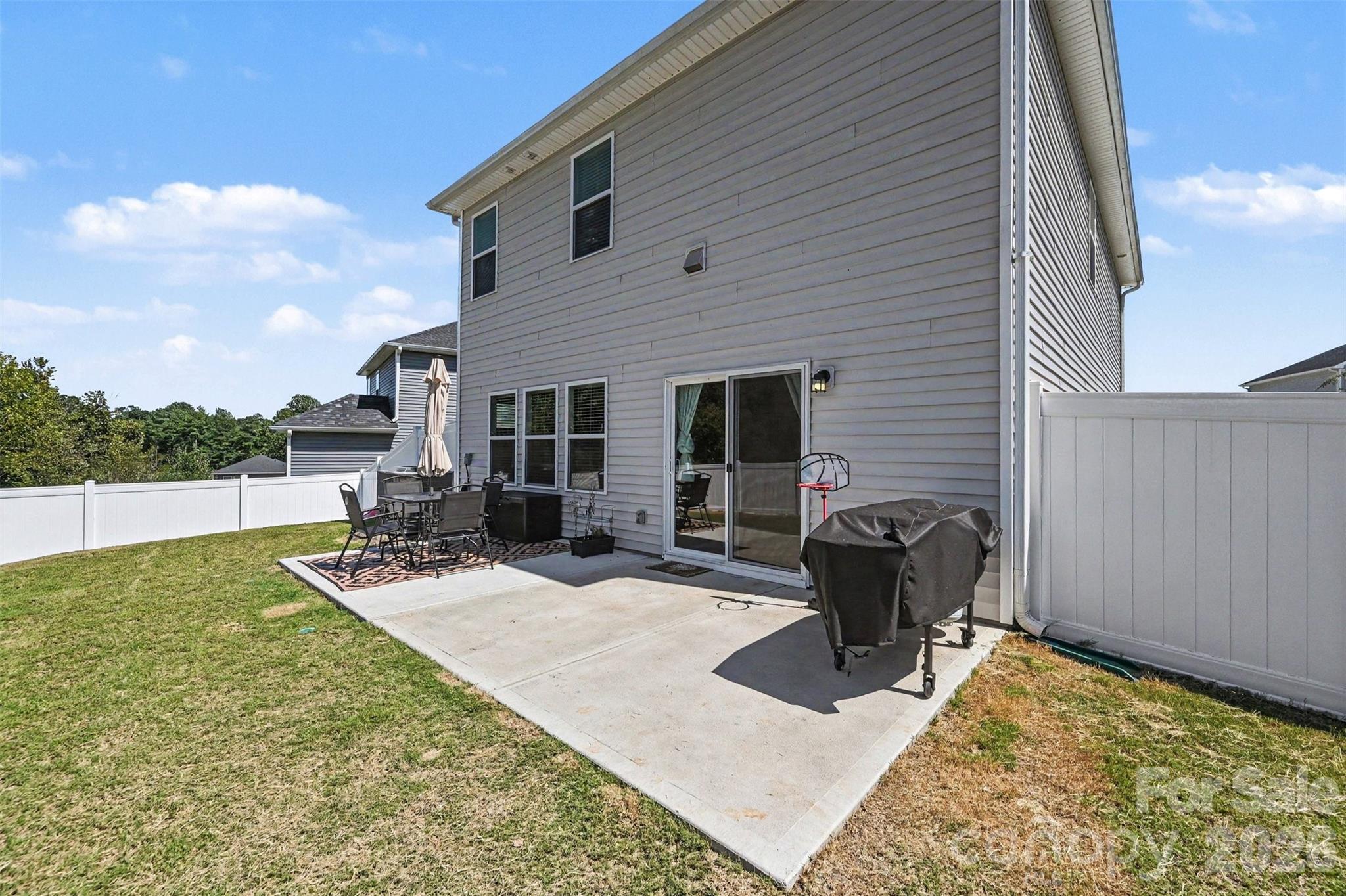 The back oversized patio has plenty of space for furniture and a grill! - 408 Luna Lane, Shelby