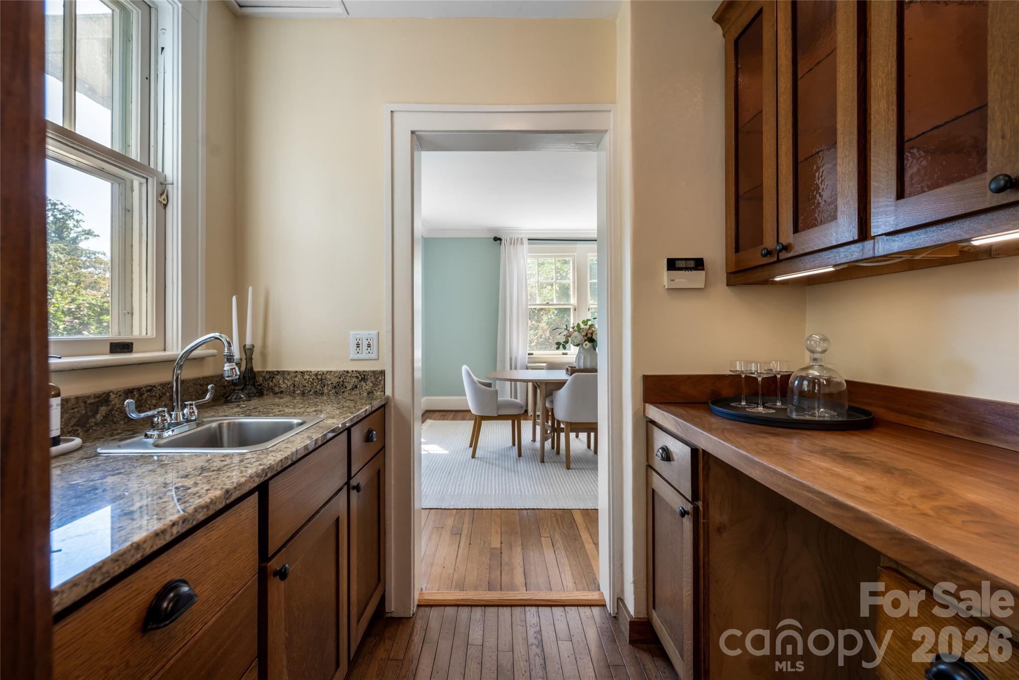 The butlers pantry has beautiful wooden counter tops and the perfect space for a wine or beverage cooler - 35 Elias Place, Asheville
