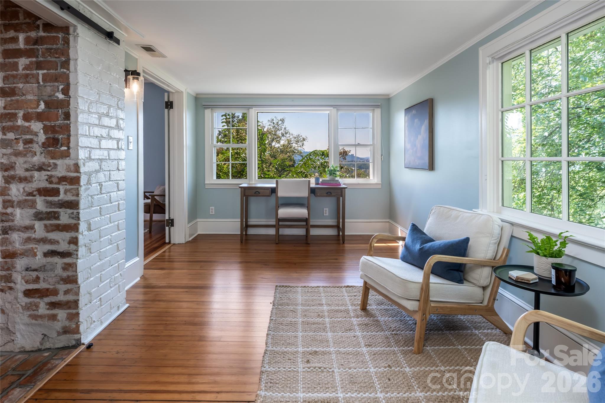 Sitting Room off the primary bedroom with views of downtown Asheville and the Western Mountains. This is one of the best spaces in the home. The ceiling in this space is just under 7ft. This is space is not counted in the marketed sqft per NCREA measuring guidelines. - 35 Elias Place, Asheville