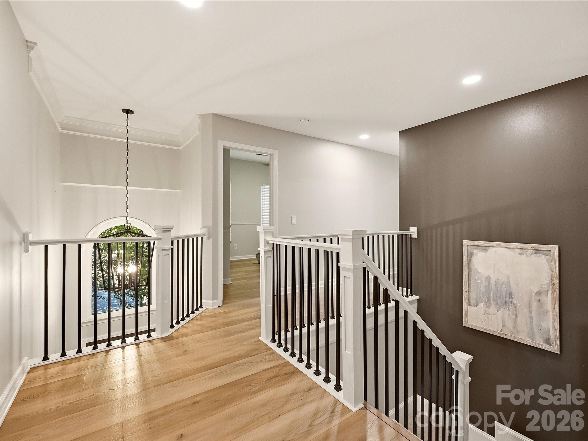 Open upper-level landing provides easy access to the home's bedrooms and additional living spaces. - 19706 Valiant Way, Cornelius
