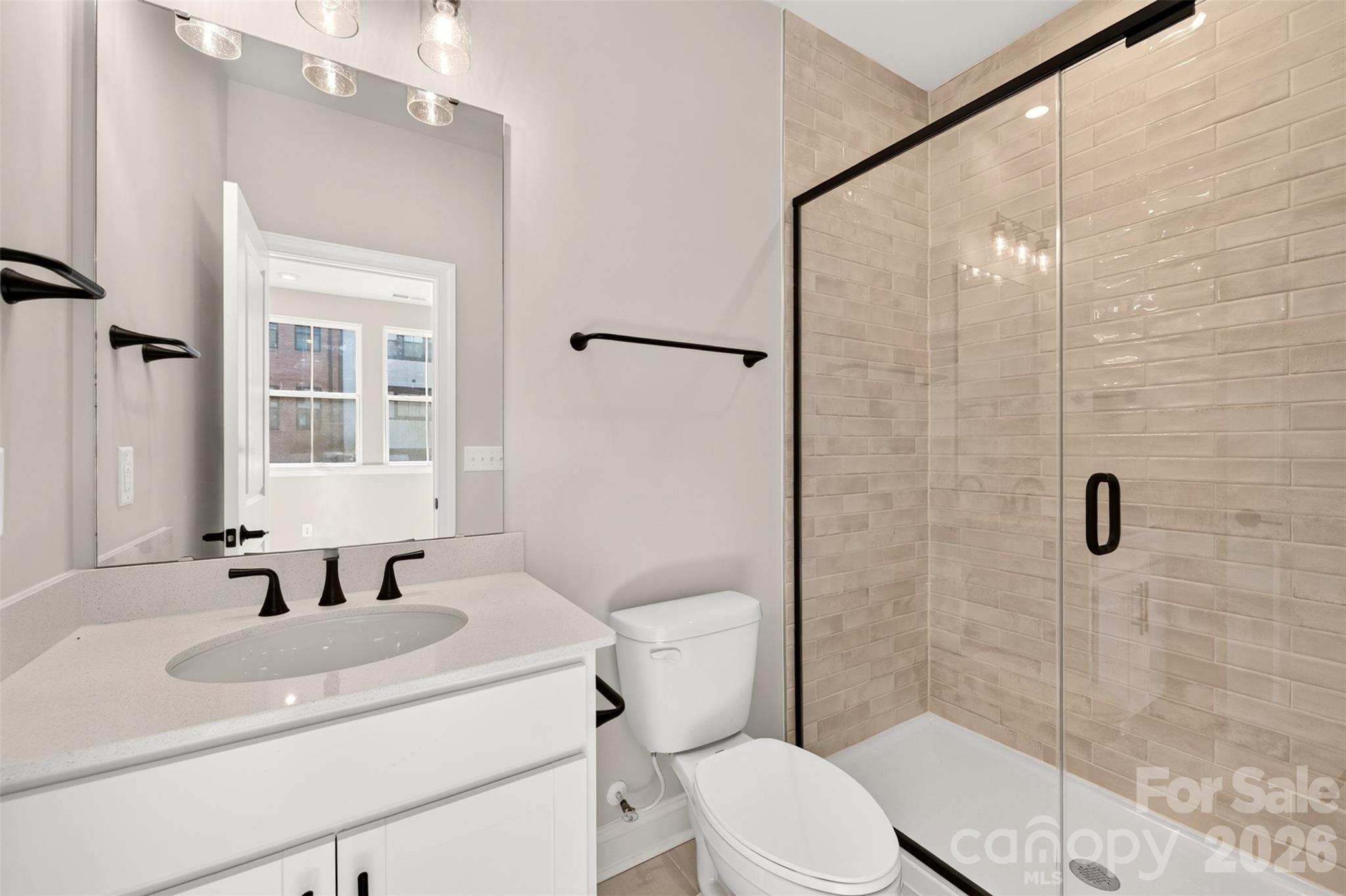 First floor bathroom with tiled wall walk-in shower - 411 Old Town Village Road, Waxhaw