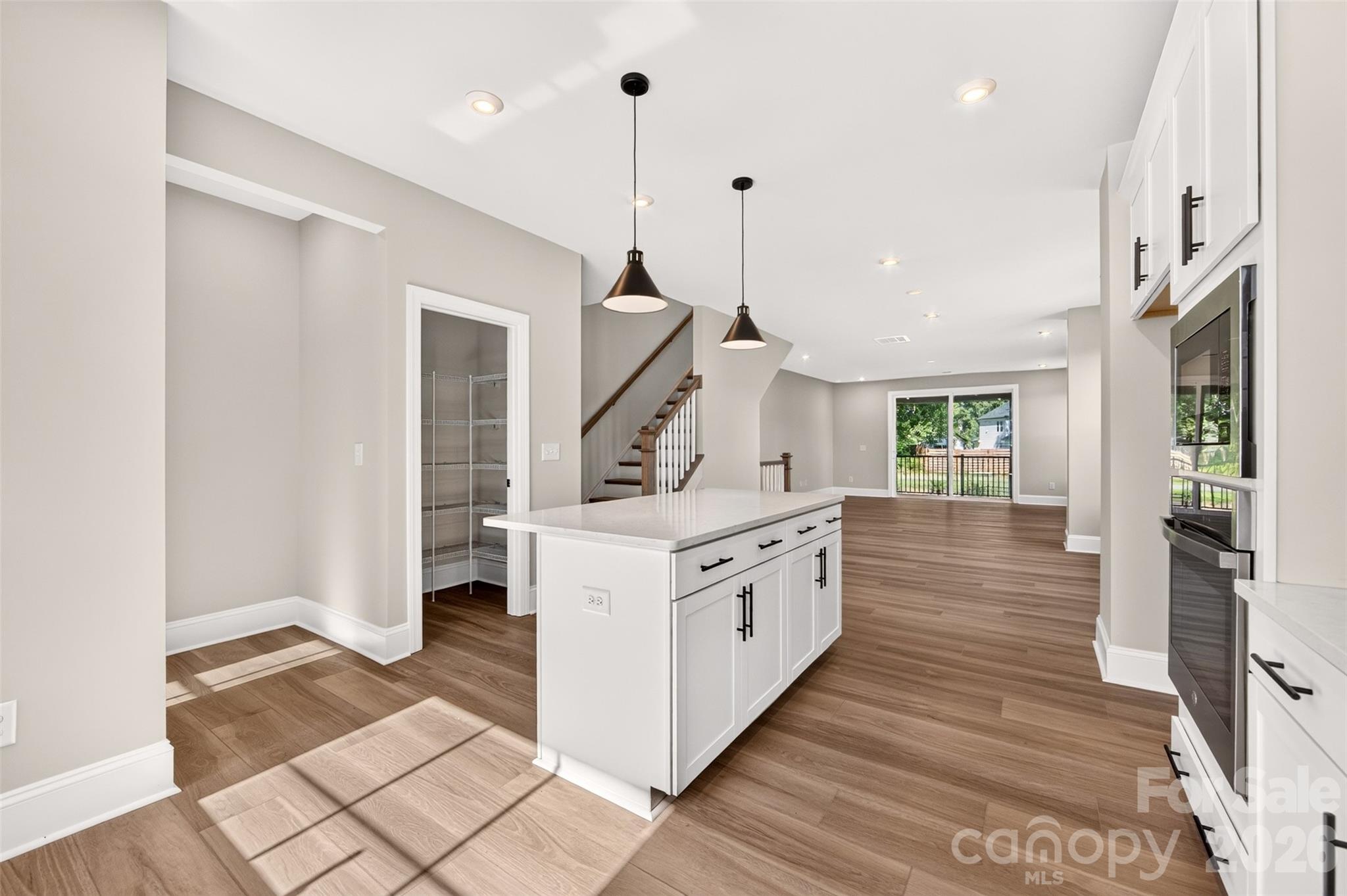 Gourmet kitchen with island and a Walk-in pantry - 411 Old Town Village Road, Waxhaw