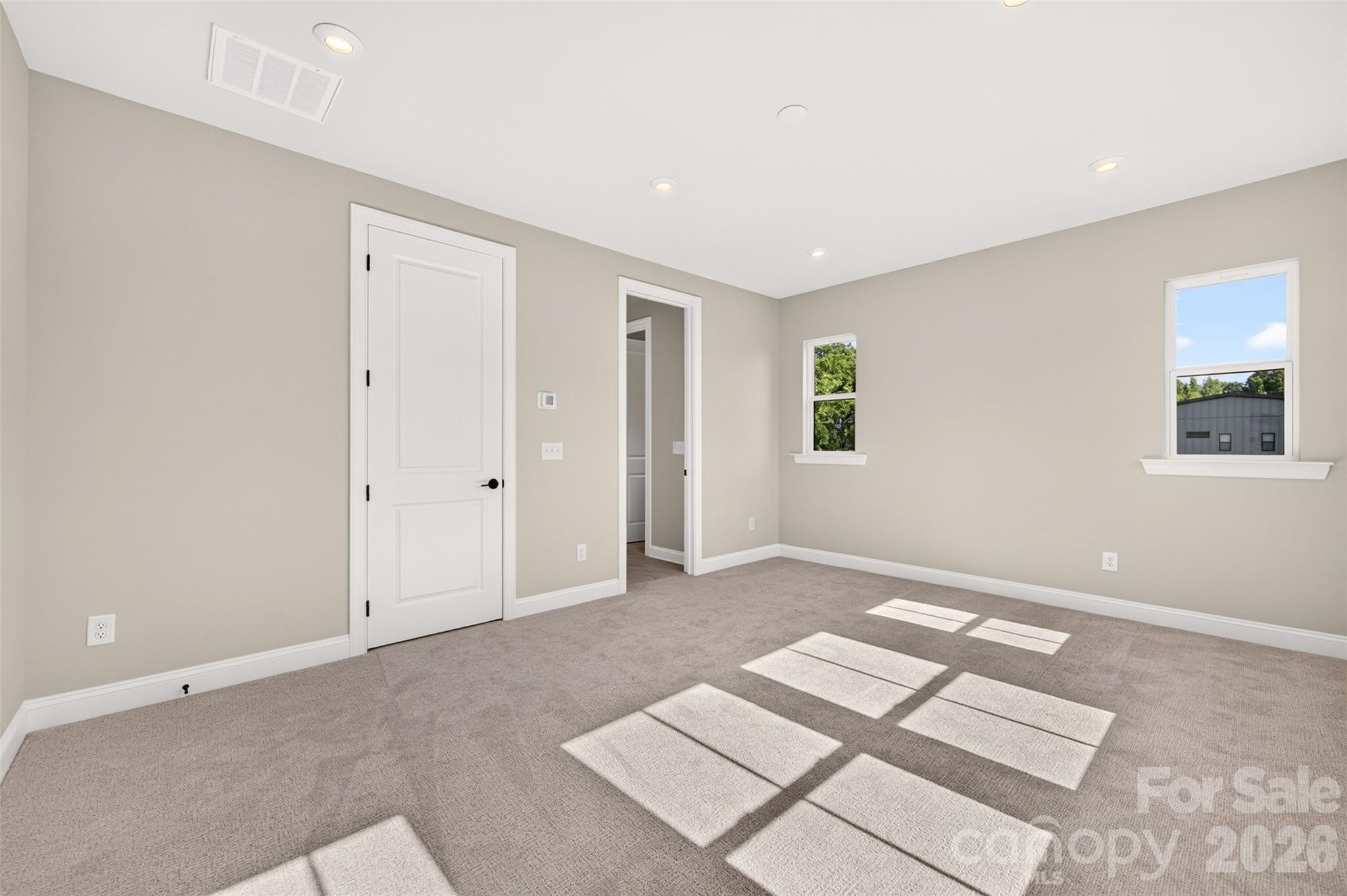 Light filled primary bedroom - 411 Old Town Village Road, Waxhaw