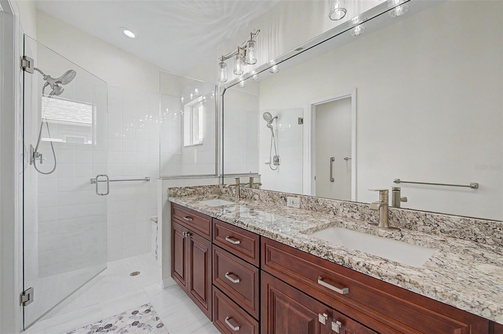 beautifully updated primary bathroom - 11709 SPINDRIFT LOOP, HUDSON
