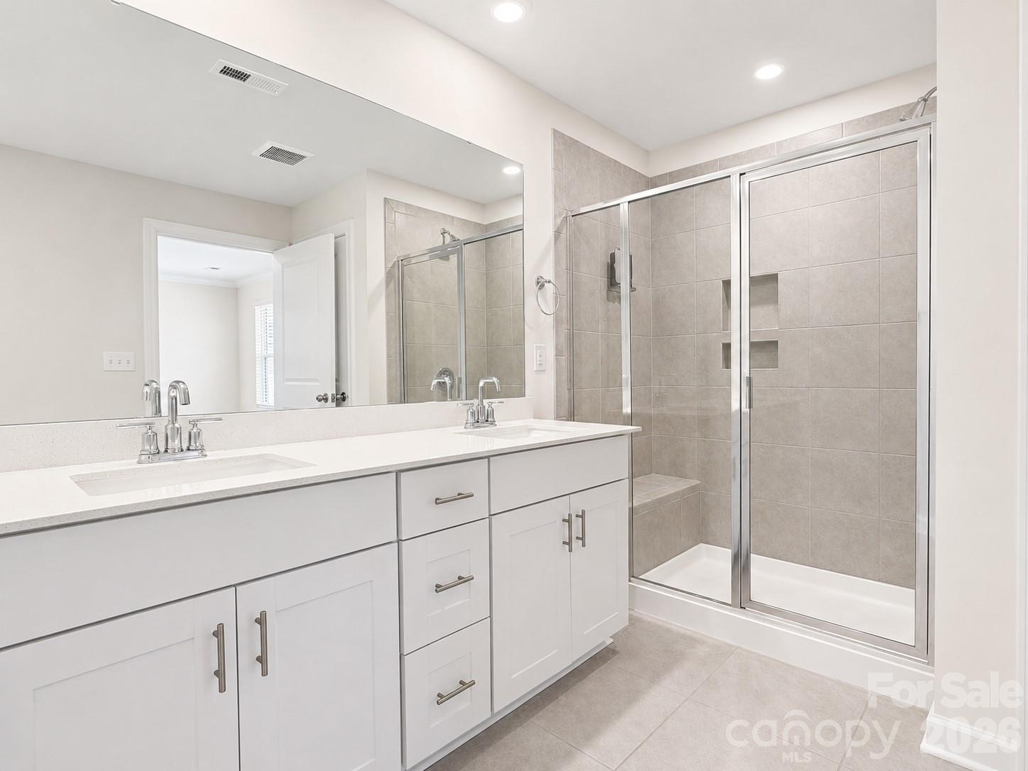 Primary bath with dual sinks, granite tops & spacious walk-in tile shower & walk-in closet. - 518 Nixon Road, Belmont