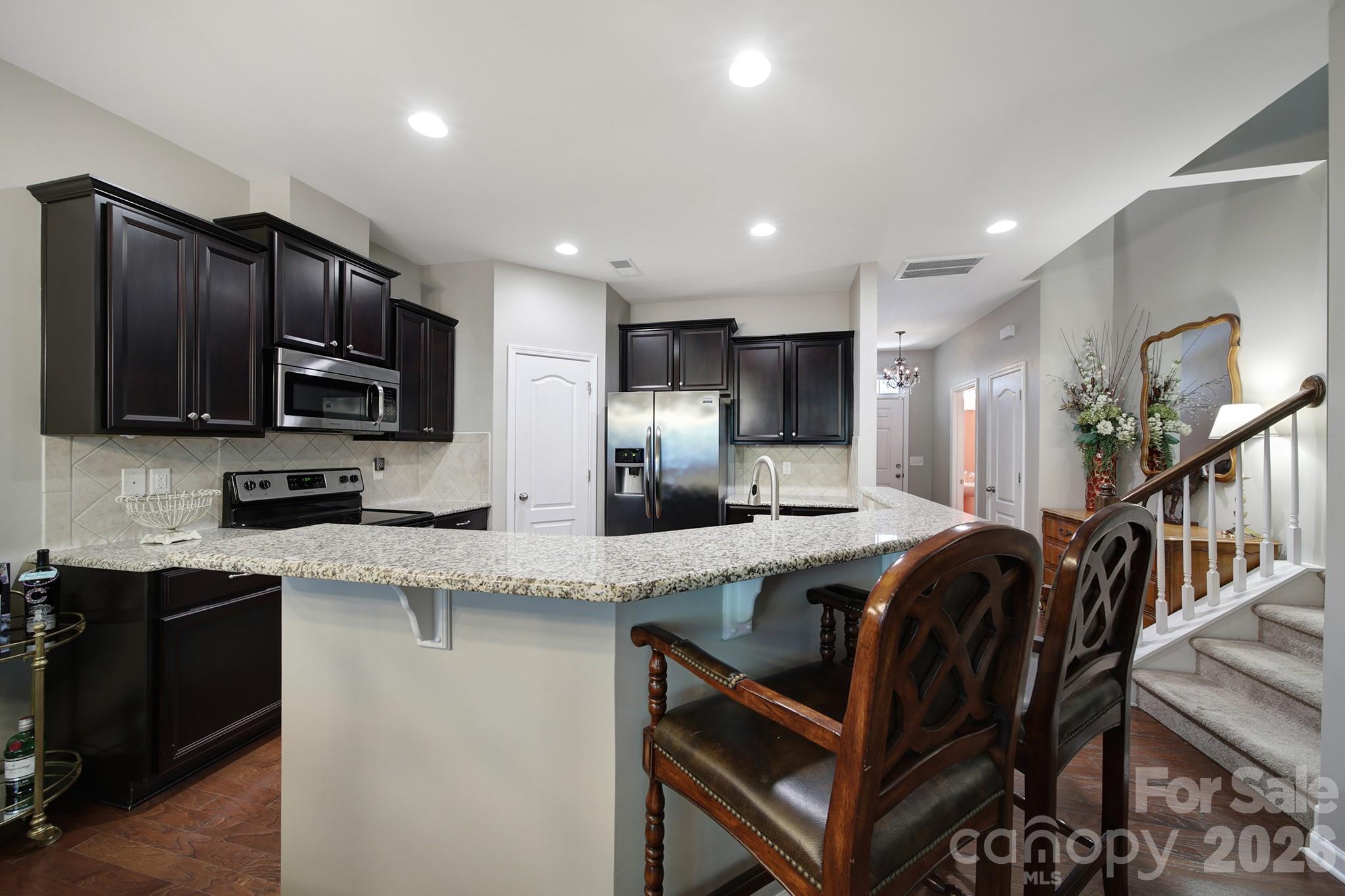 Kitchen with Breakfast Bar - 7021 Woodsbay Lane, Rock Hill