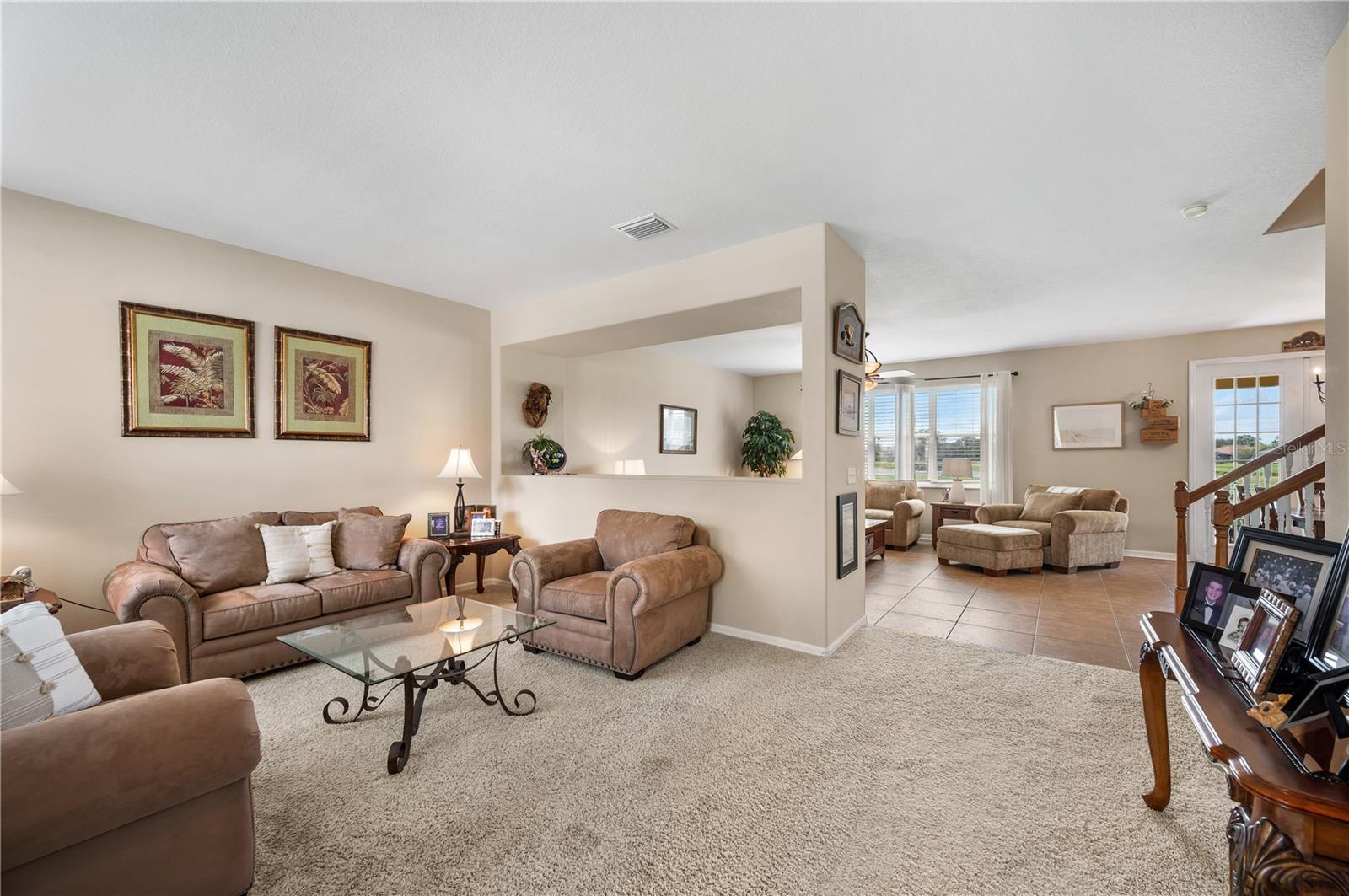 As you enter ,the view from the front to the rear of the home is spectacular. The Open floor plan lends itself to seamless entertaining and family fun. - 6937 LAKE EAGLEBROOKE DR, LAKELAND