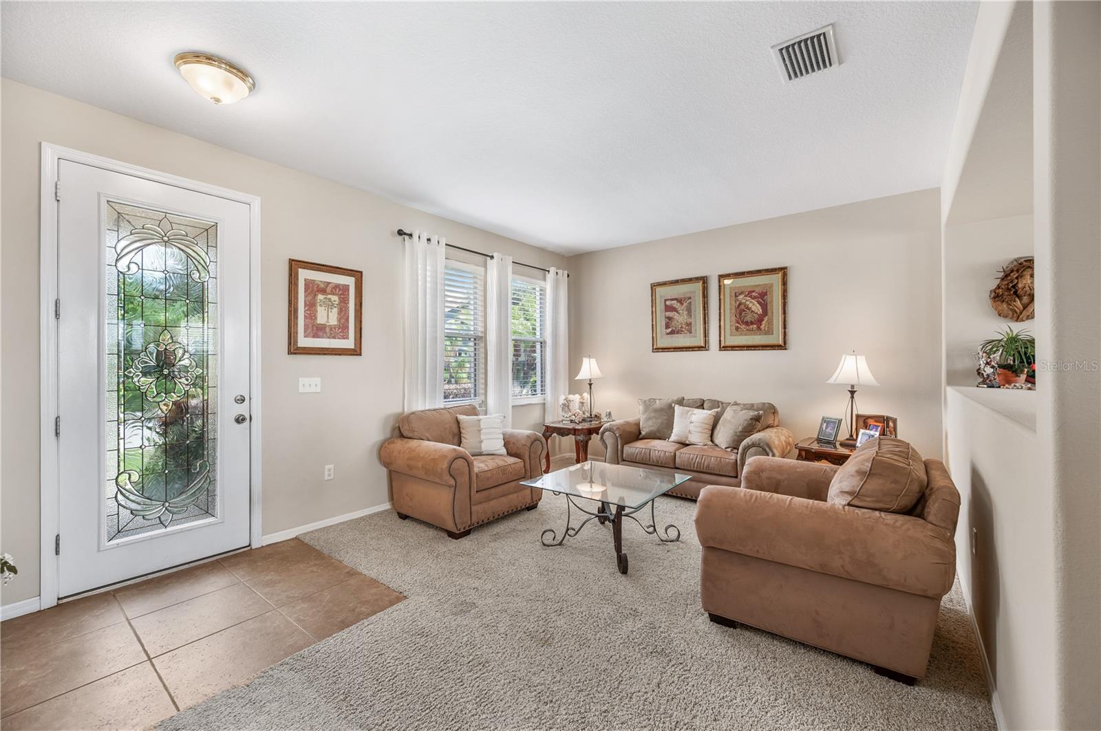 Flooded with natural light , one of the homes main social spaces is light & bright! - 6937 LAKE EAGLEBROOKE DR, LAKELAND