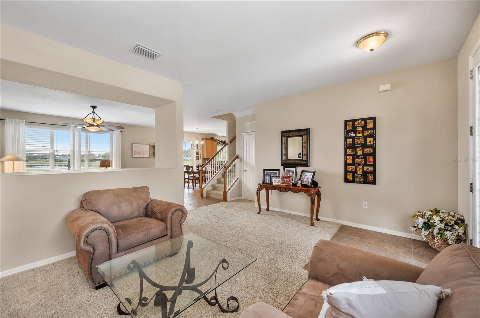 The flow from the living room into the family room ... - 6937 LAKE EAGLEBROOKE DR, LAKELAND