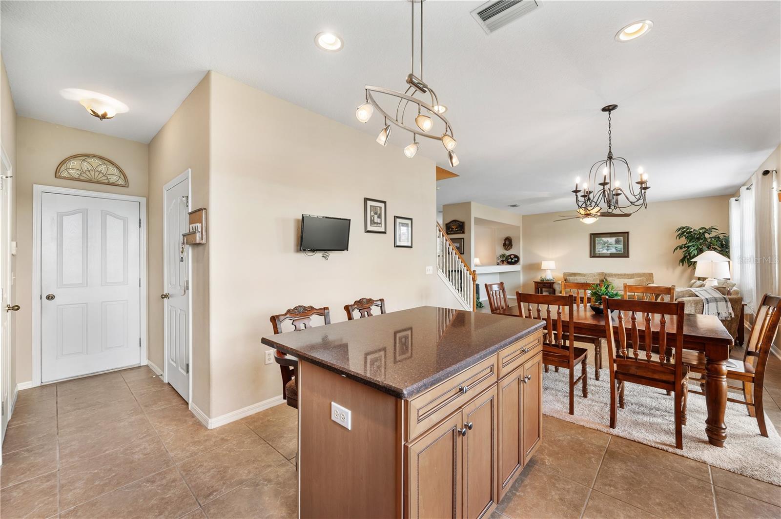 Right of f the kitchen is a well appointed half bathroom and exit to a large 2 car garage . - 6937 LAKE EAGLEBROOKE DR, LAKELAND