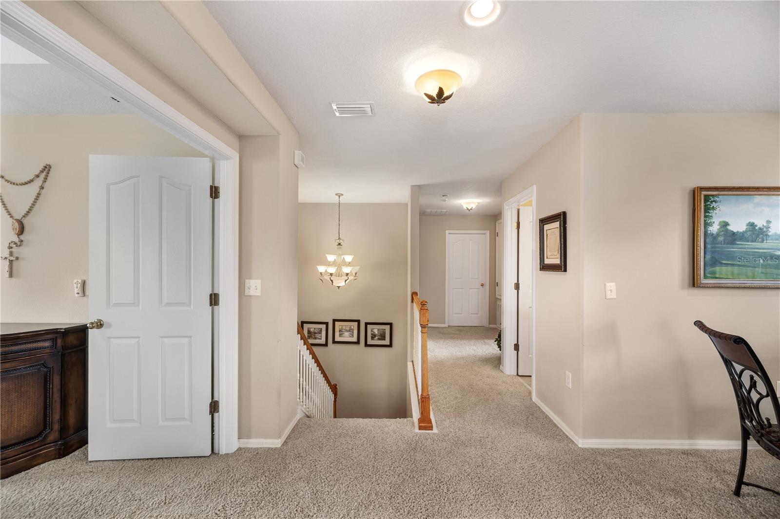 Upstairs , there are 3 bedrooms including the Primary bedroom along with an awesome media, game, movie room..perfect for family fun nights! - 6937 LAKE EAGLEBROOKE DR, LAKELAND