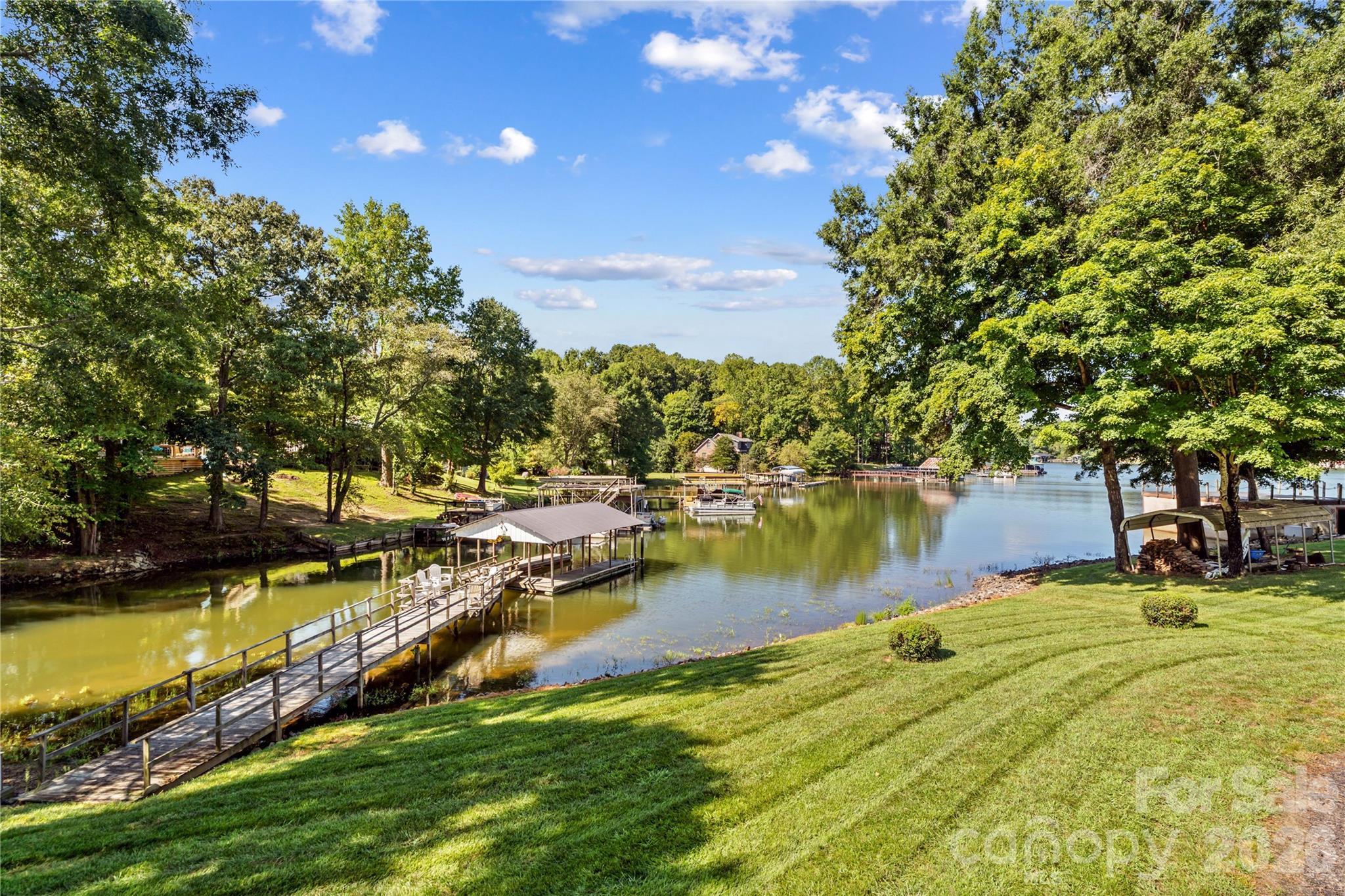 Pier and lake view from the deck of the house - 150 Shady Cove Drive, Troutman