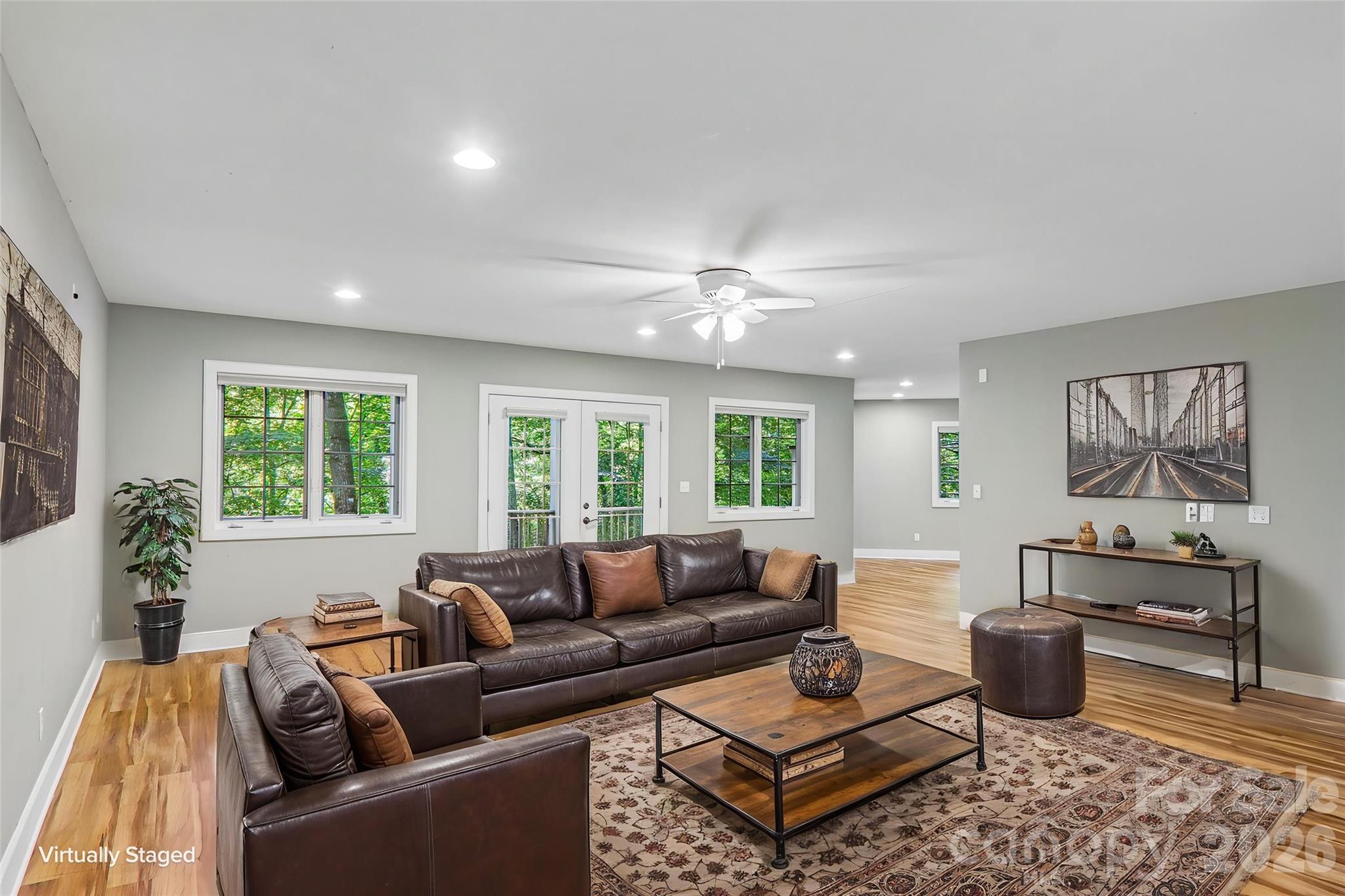 Virtually staged basement living area - 361 Mills River Way, Horse Shoe