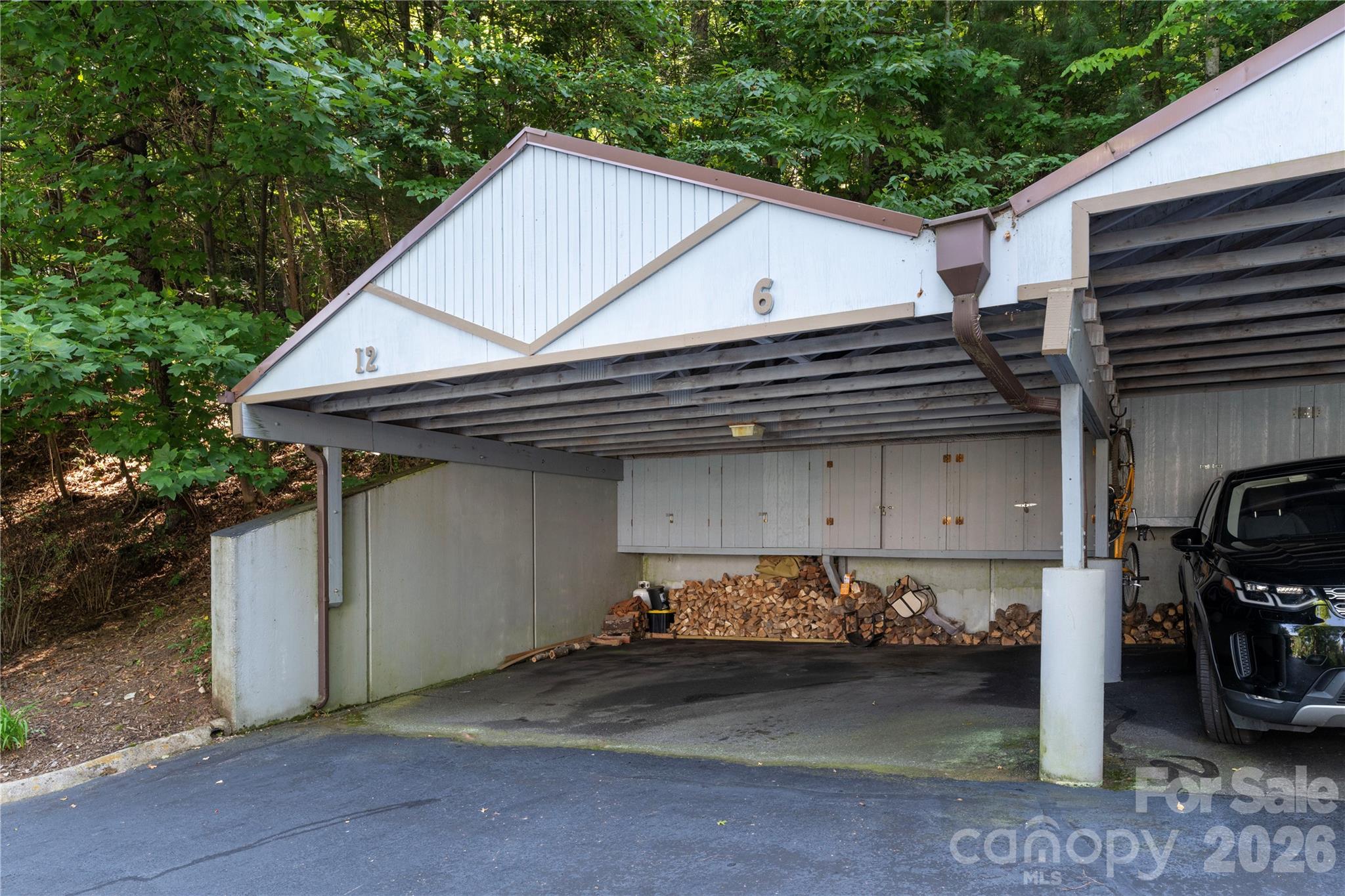 Carport with storage. - 87 Willow Road, Waynesville