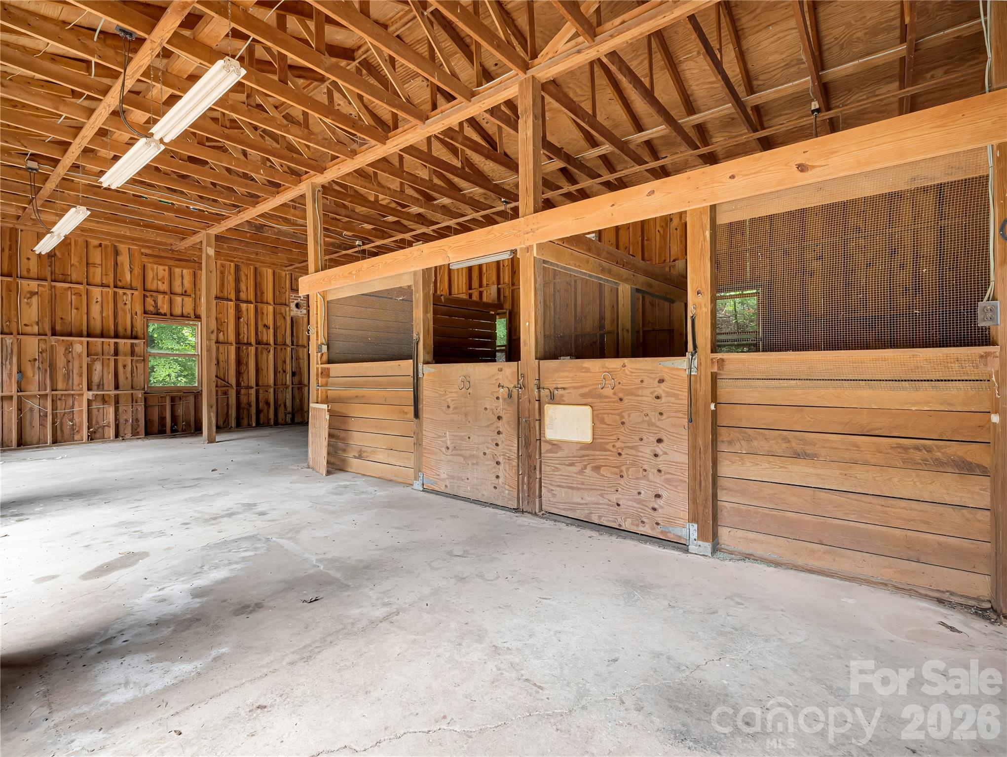Stalls are appr. 11'x11' with rubber mats. Water and electric in place. Level slab floor. - 989 Fox Mountain Road, Columbus
