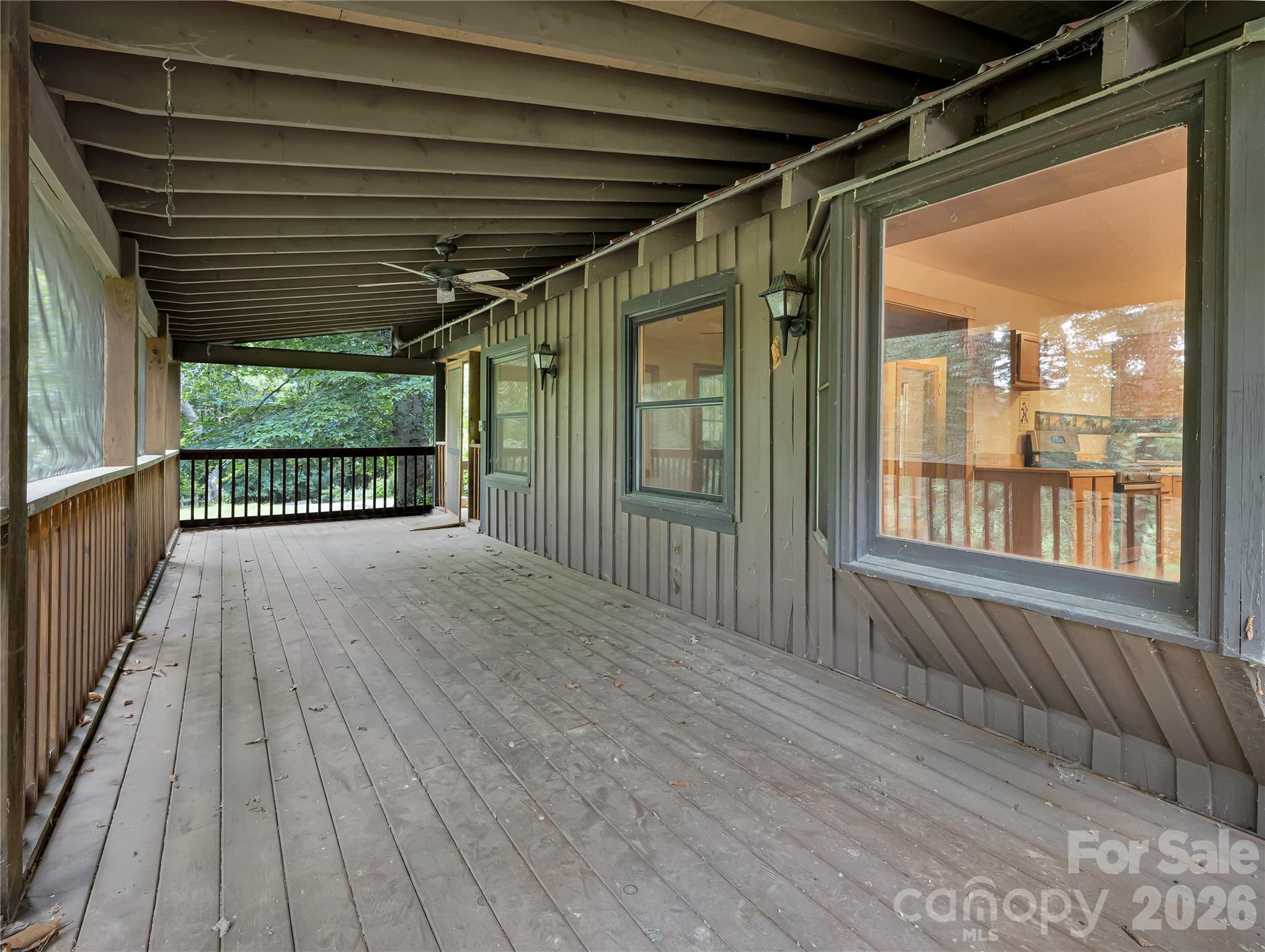 Huge screened in porch runs the length of the house and looks out over the horse pastures. - 989 Fox Mountain Road, Columbus