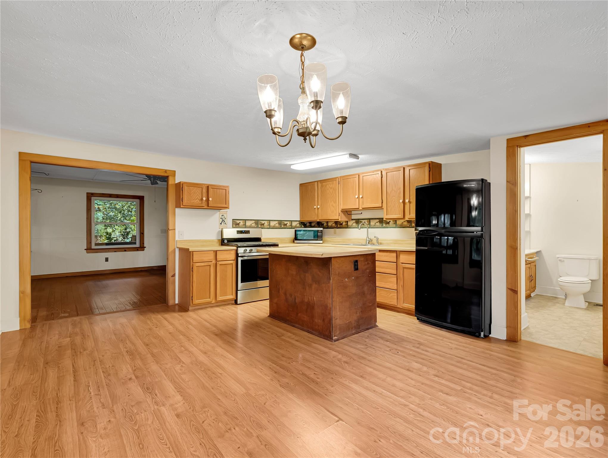 Kitchen has a sloped ceiling that is under 8' at the lower end. - 989 Fox Mountain Road, Columbus