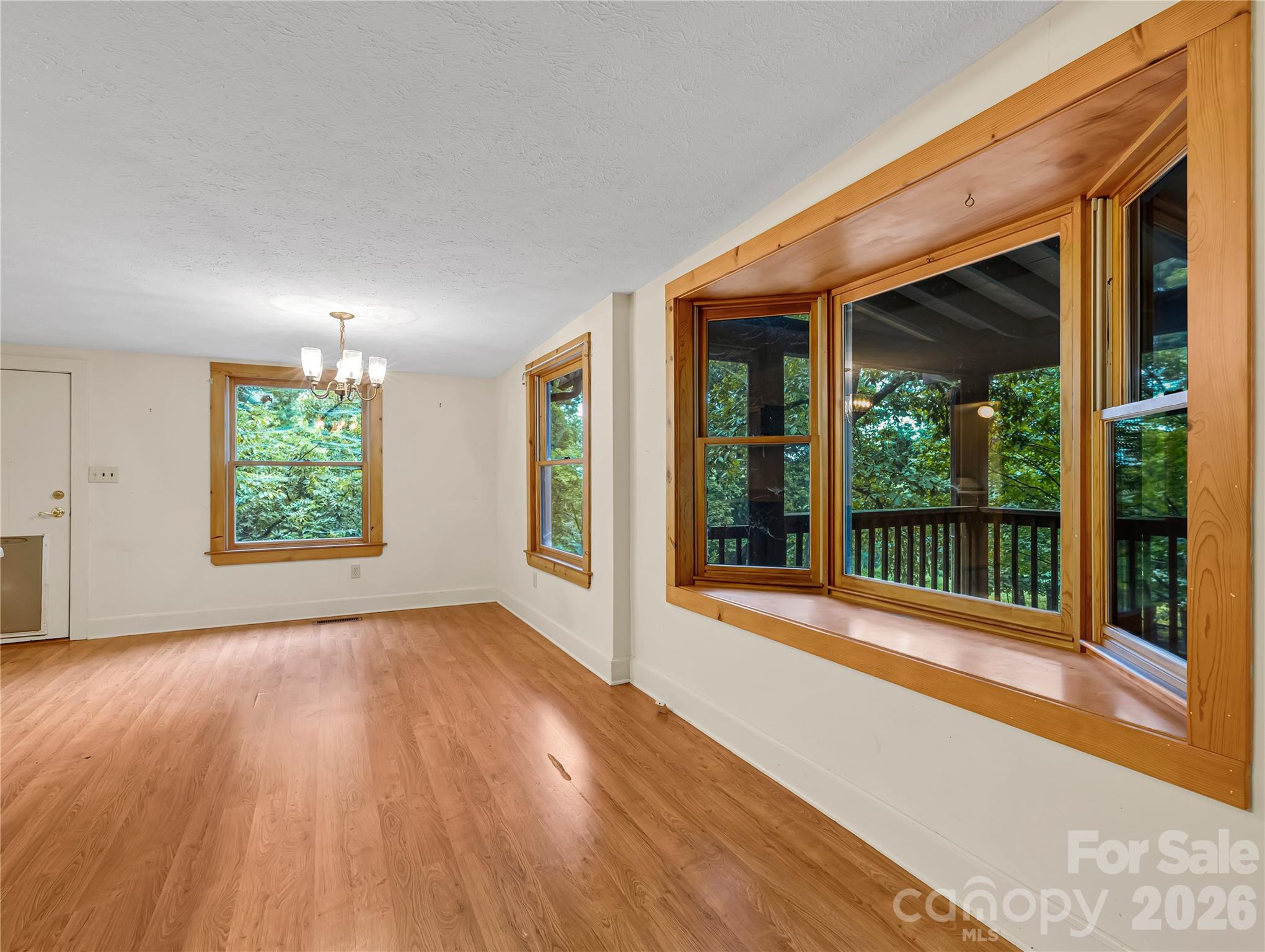 Dining area in the kitchen looks out toward the horse pasture and screened porch. - 989 Fox Mountain Road, Columbus