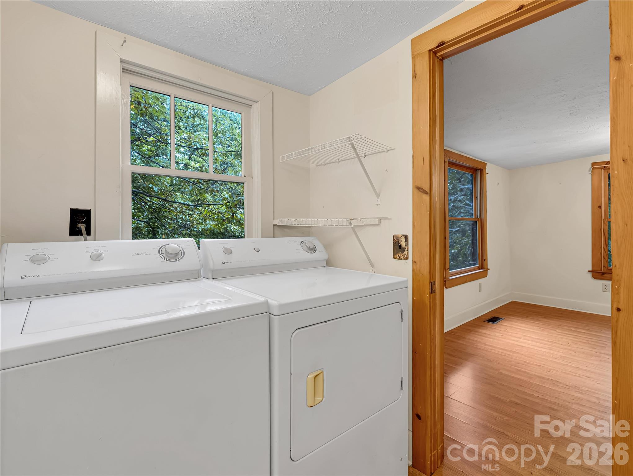 Second full bath has a full size washer and dryer that convey with the house. - 989 Fox Mountain Road, Columbus