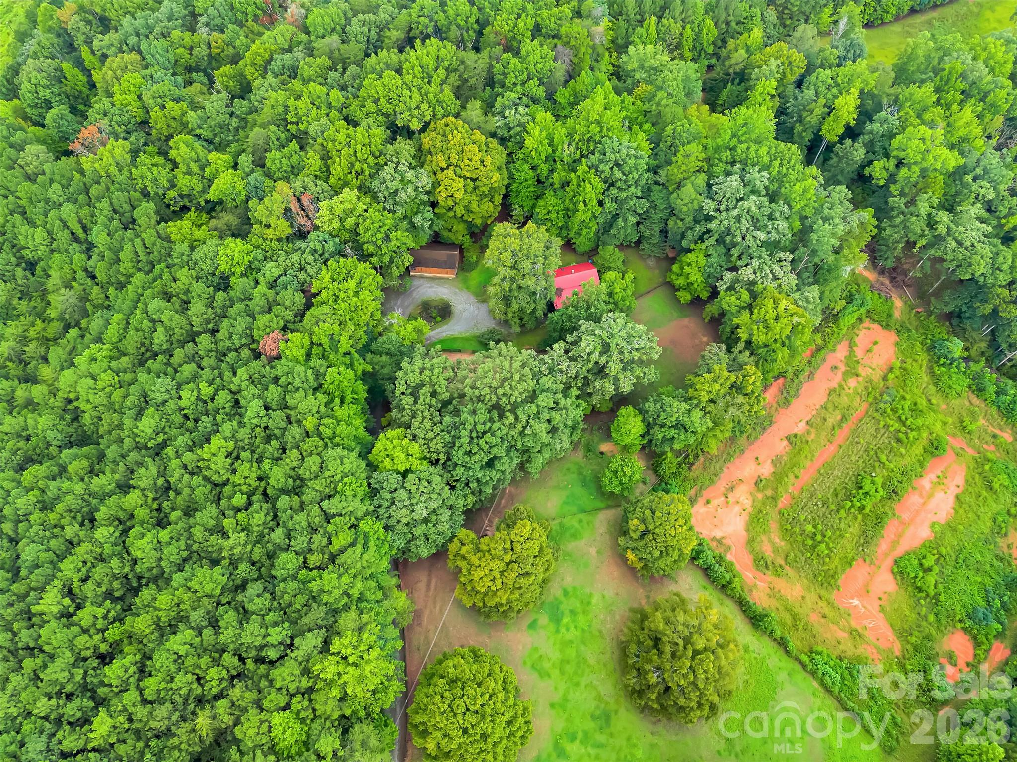 Photo shows barn and red roof is house. Bare clay area is the neighbors land. - 989 Fox Mountain Road, Columbus
