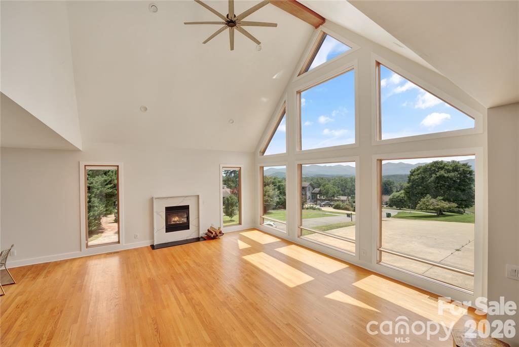 Great room boasts vaulted ceilings and a wood burning fireplace - 8 Nottingham Drive, Candler