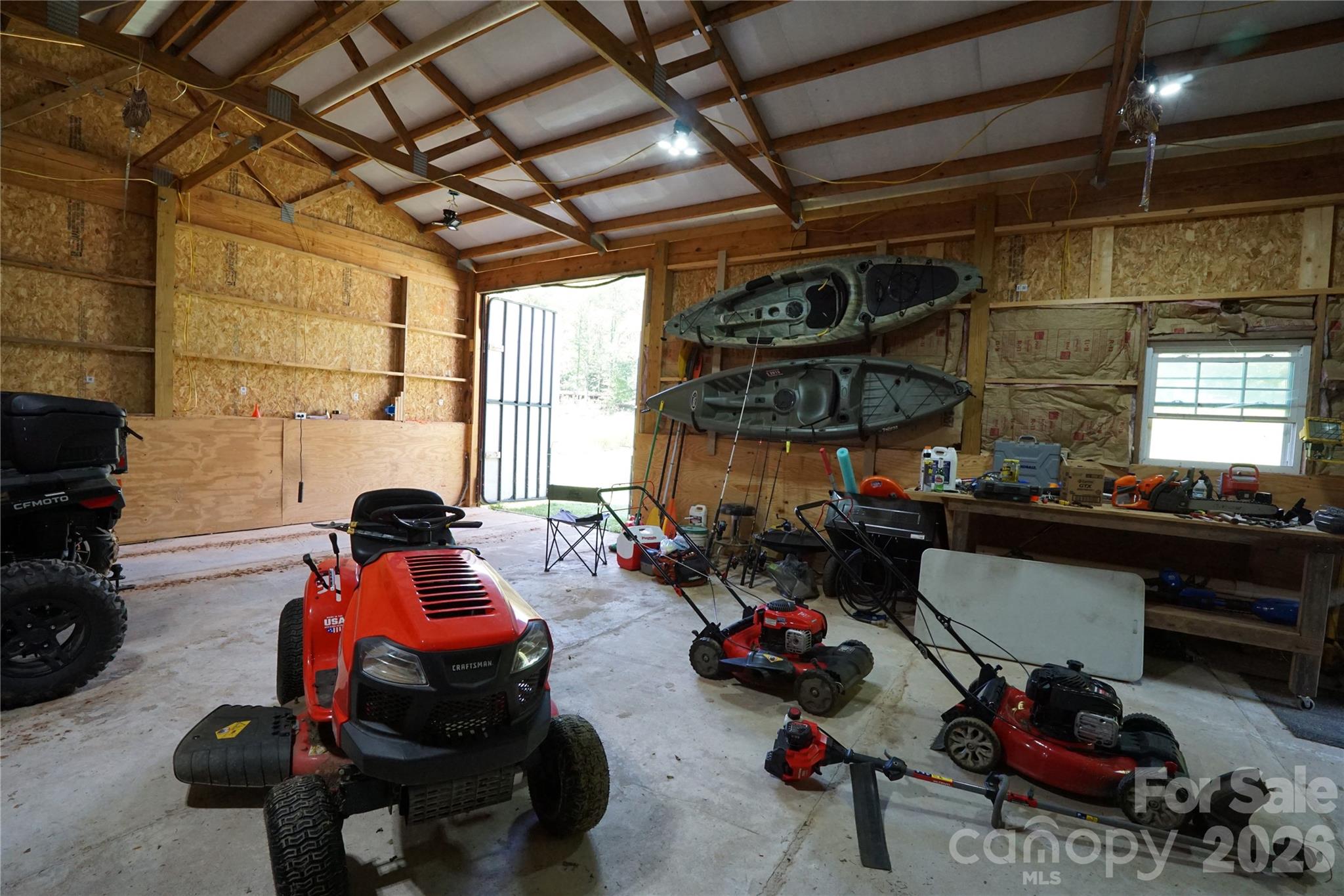 744 SF workshop with cement floor, electricity, and water just outside entrance. - 1239 W McGuinn Road, Mill Spring