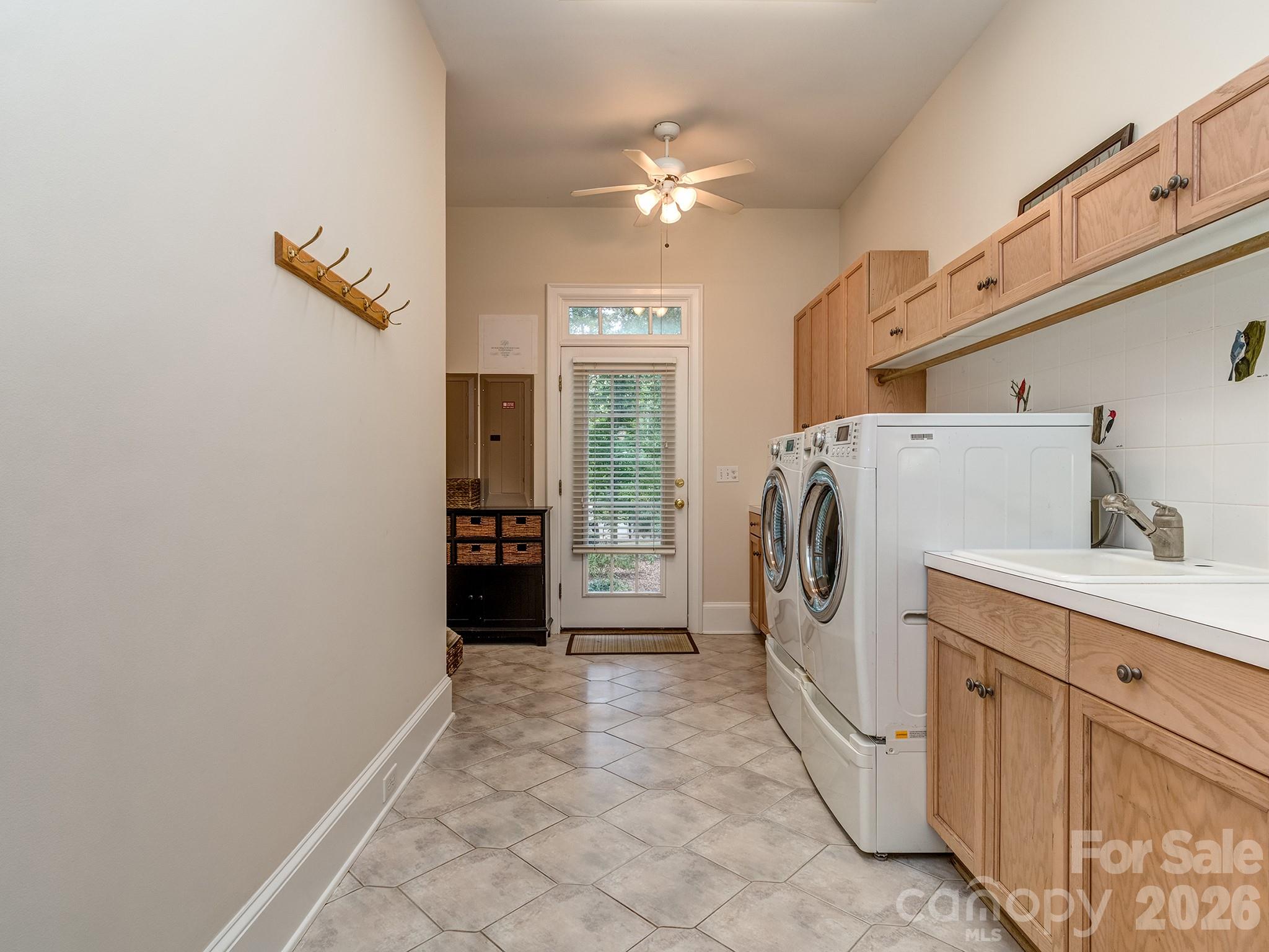 Laundry room on main floor with sink - 1733 White Pond Lane, Waxhaw