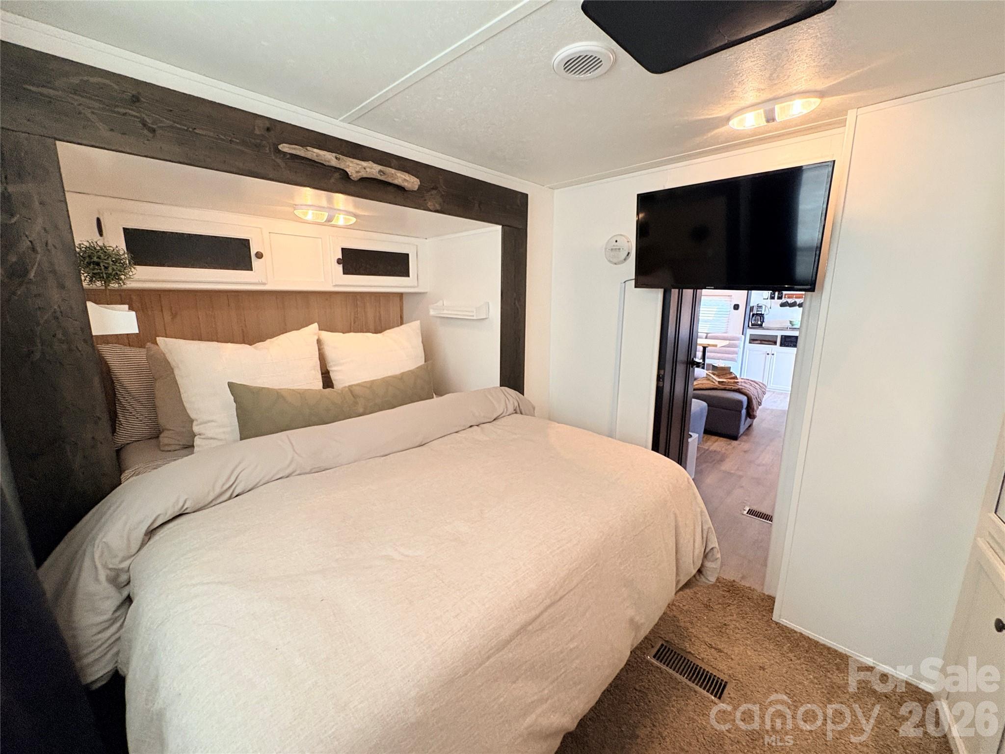 Mounted TV has a swivel arm to watch TV from Bed - 221 Grand View Drive, New London