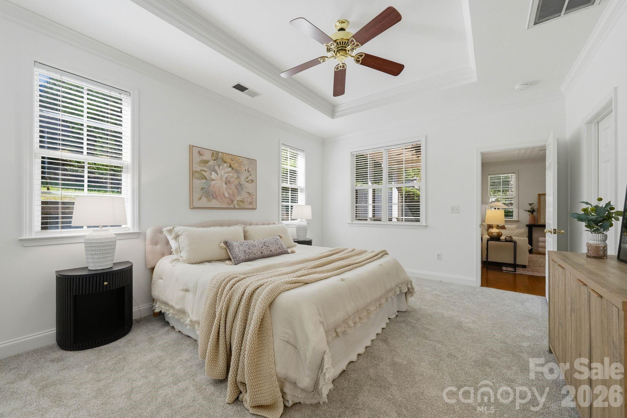 Comfortable main-level primary suite offering privacy, functionality, and excellent closet space. - 18810 Cloverstone Circle, Cornelius