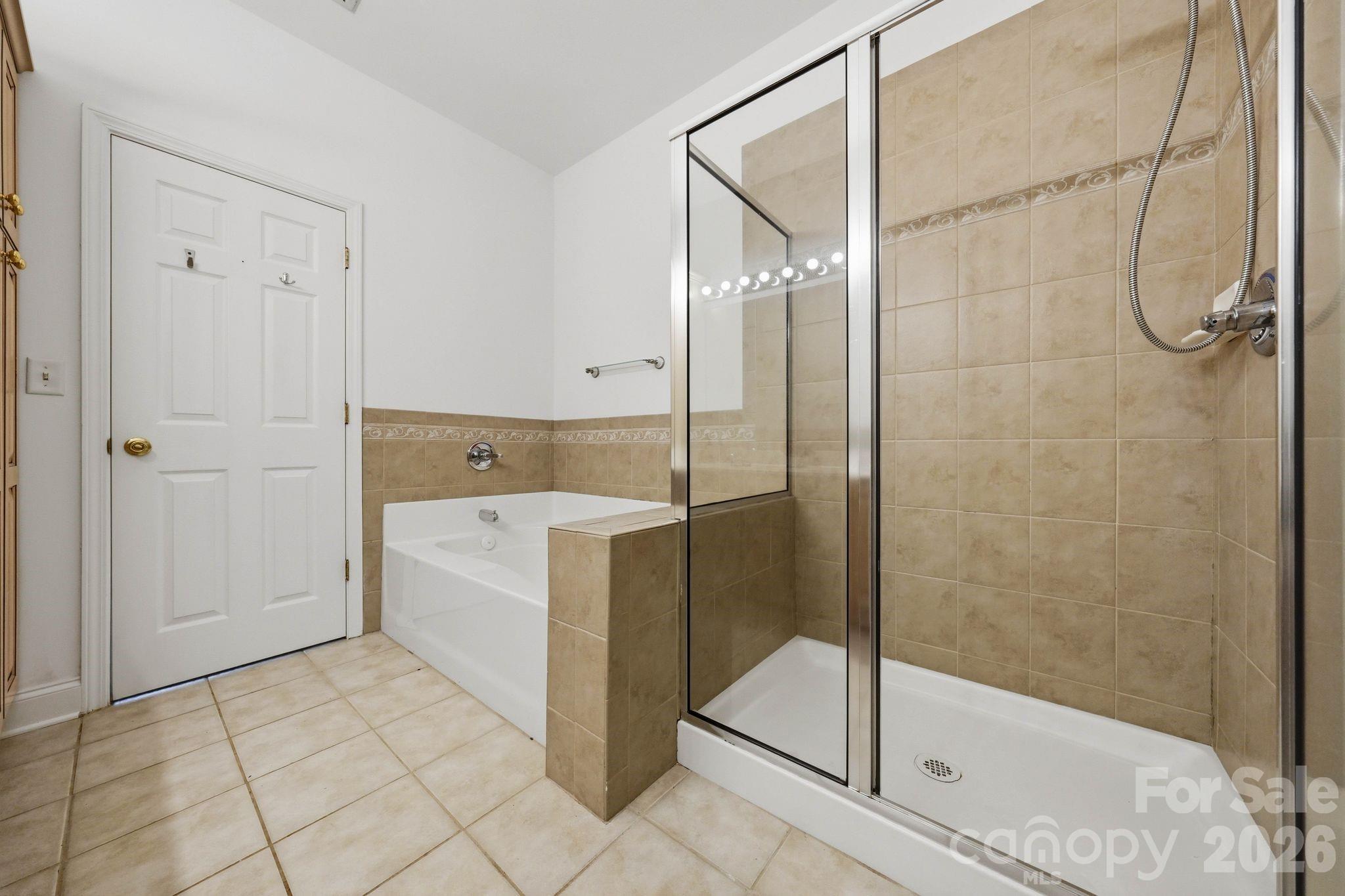 Bright, functional primary bathroom with plenty of room for everyday routines. - 18810 Cloverstone Circle, Cornelius