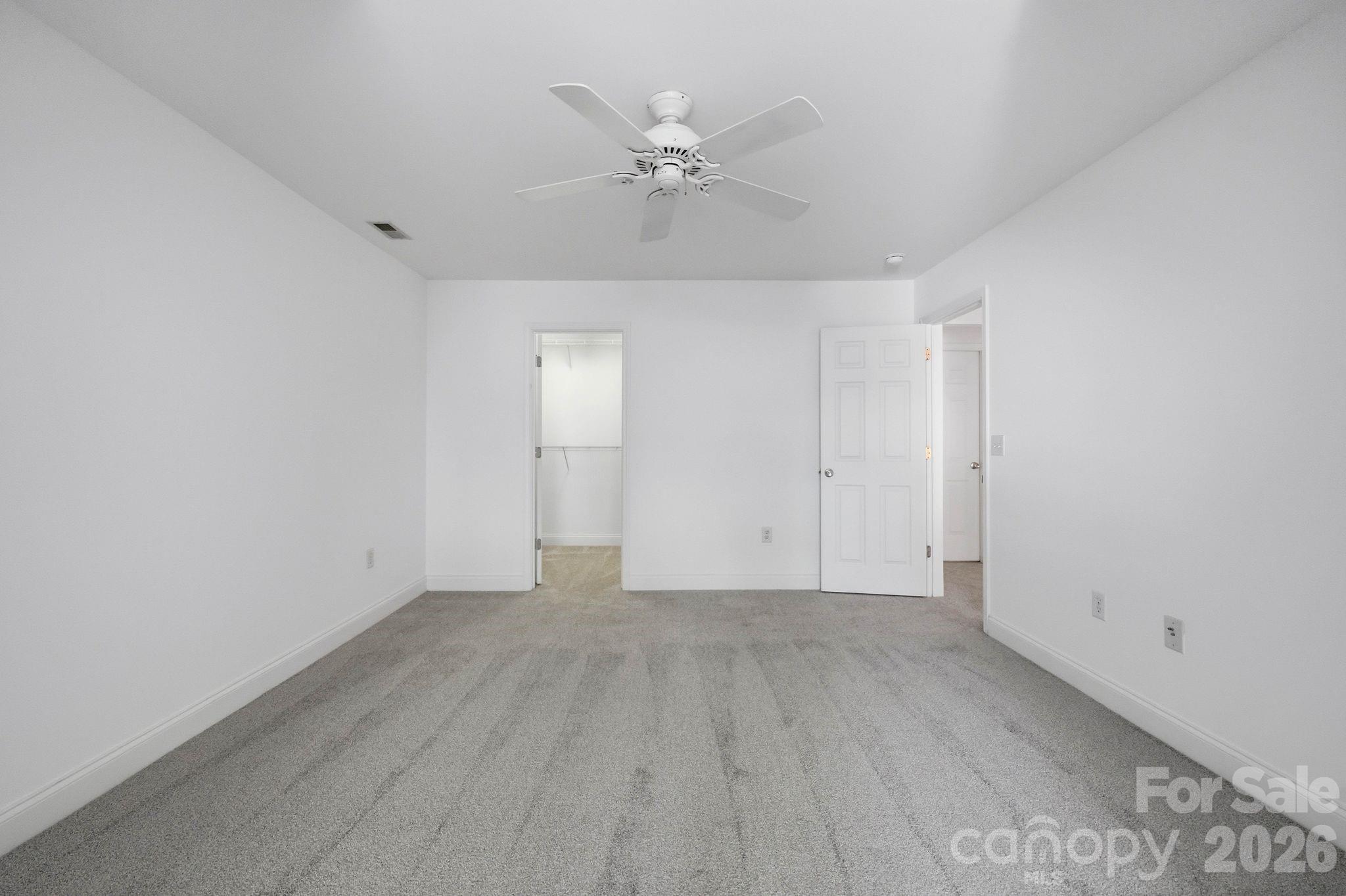 Upstairs bedroom offers a functional layout with room for a variety of furniture arrangements. - 18810 Cloverstone Circle, Cornelius