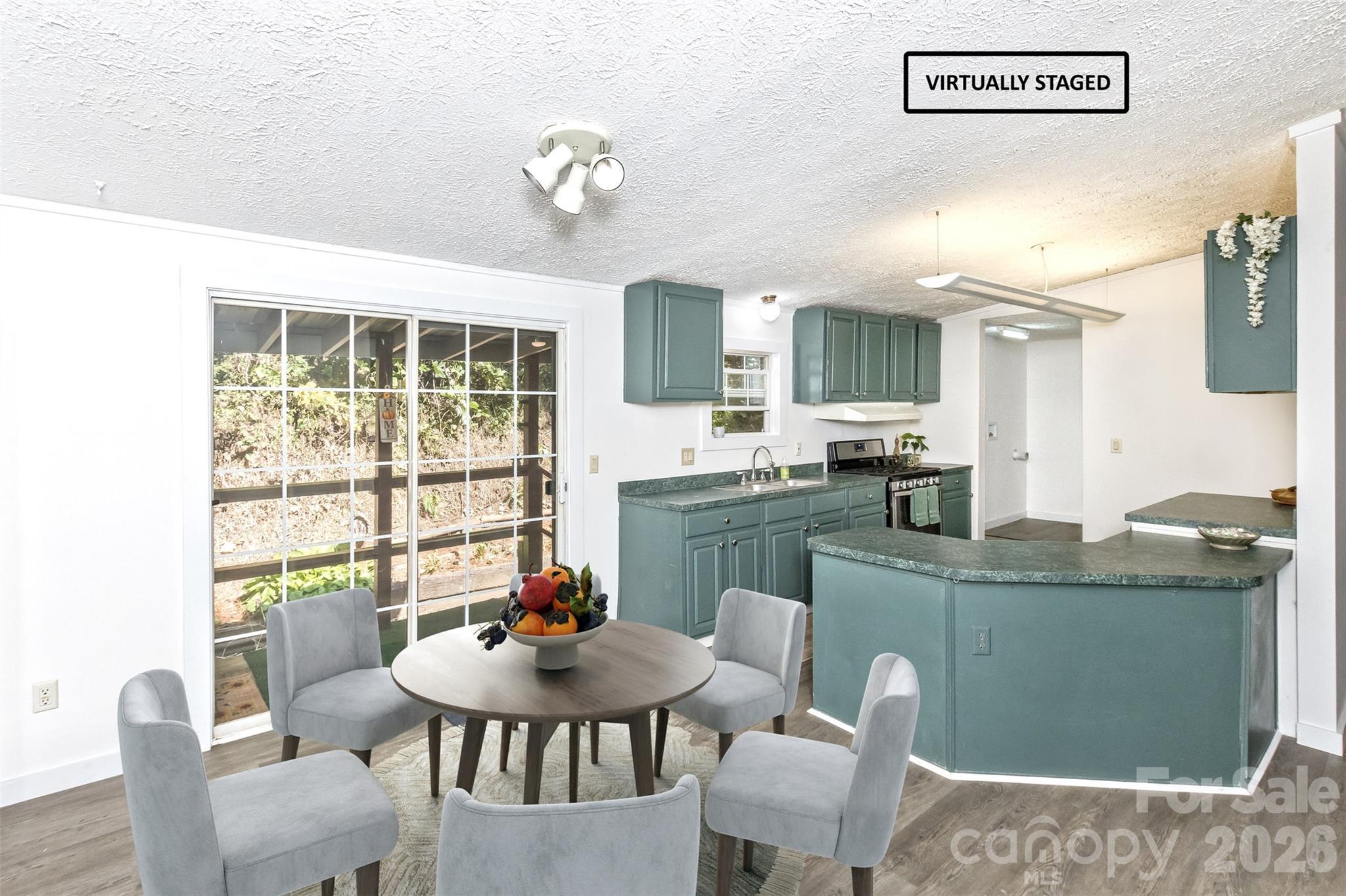 Virtual staged dining and Kitchen - 13 Cattail Drive, Sylva