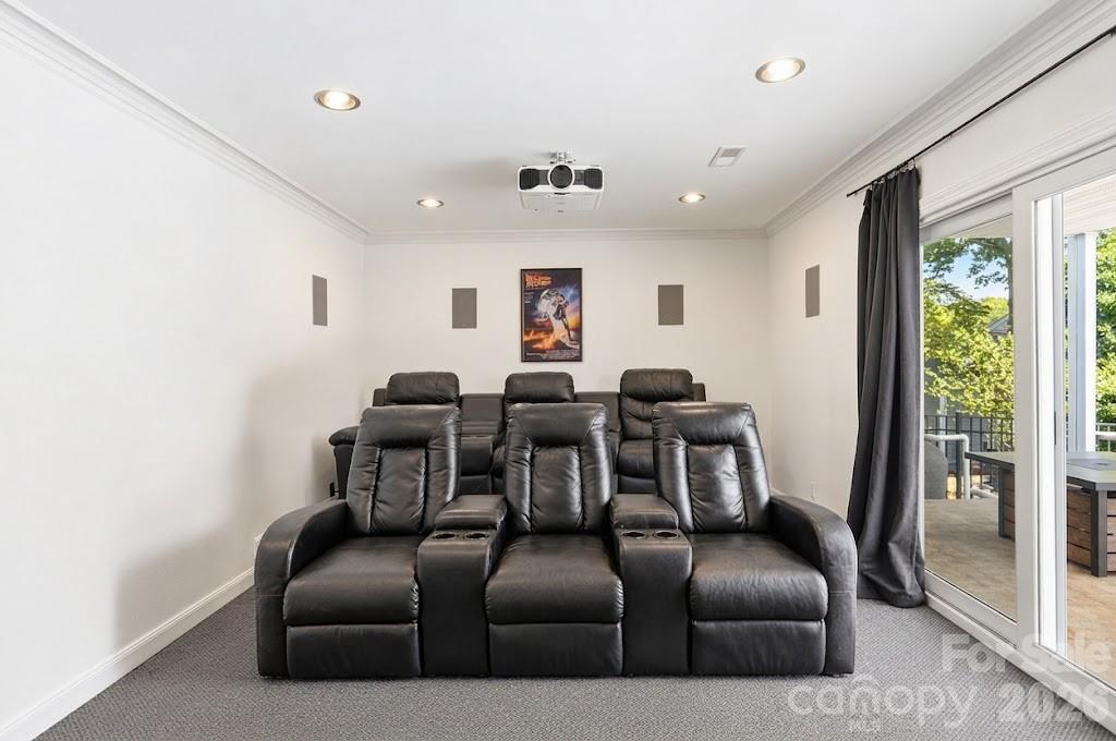 Movie night just got an upgrade! Enjoy your own theater room with a projector, big screen and theater-style seating. - 3022 Point Clear Drive, Tega Cay