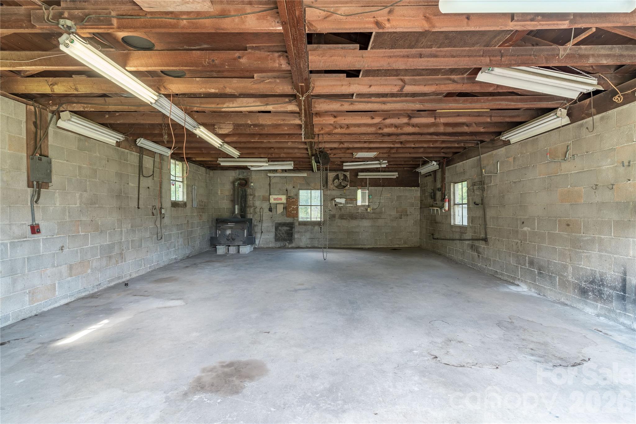 Shop is 25'x35' and has electric, water, wood stove, lots of space and an engine hoist that is included - 5271 Harris Farm Road, Hickory
