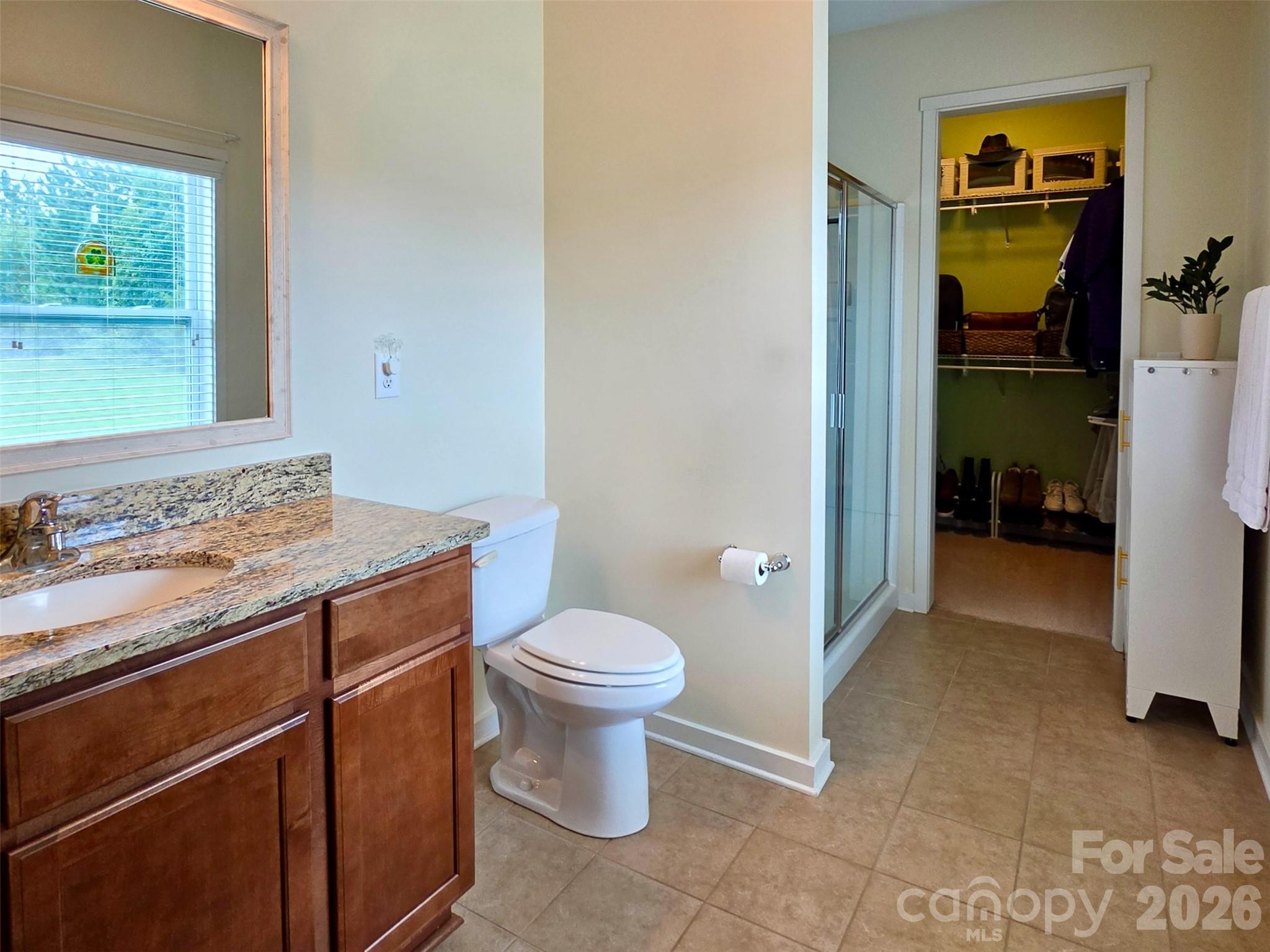 Primary Bathroom w Seated Shower and Walk-In Closet - 5227 Crystal Lakes Drive, Rock Hill