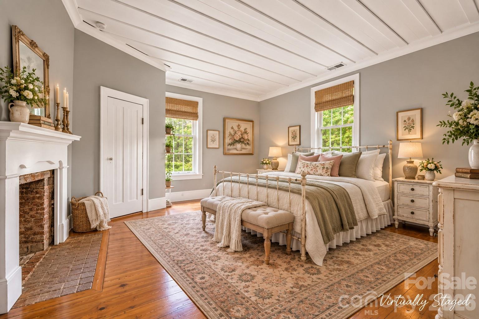 Three large bedrooms, all with fireplaces and original wood mantles, board-and-batten ceilings. Rugs cut to room dimensions can are just sitting on the hardwood floors. - 10915 Beatties Ford Road, Huntersville