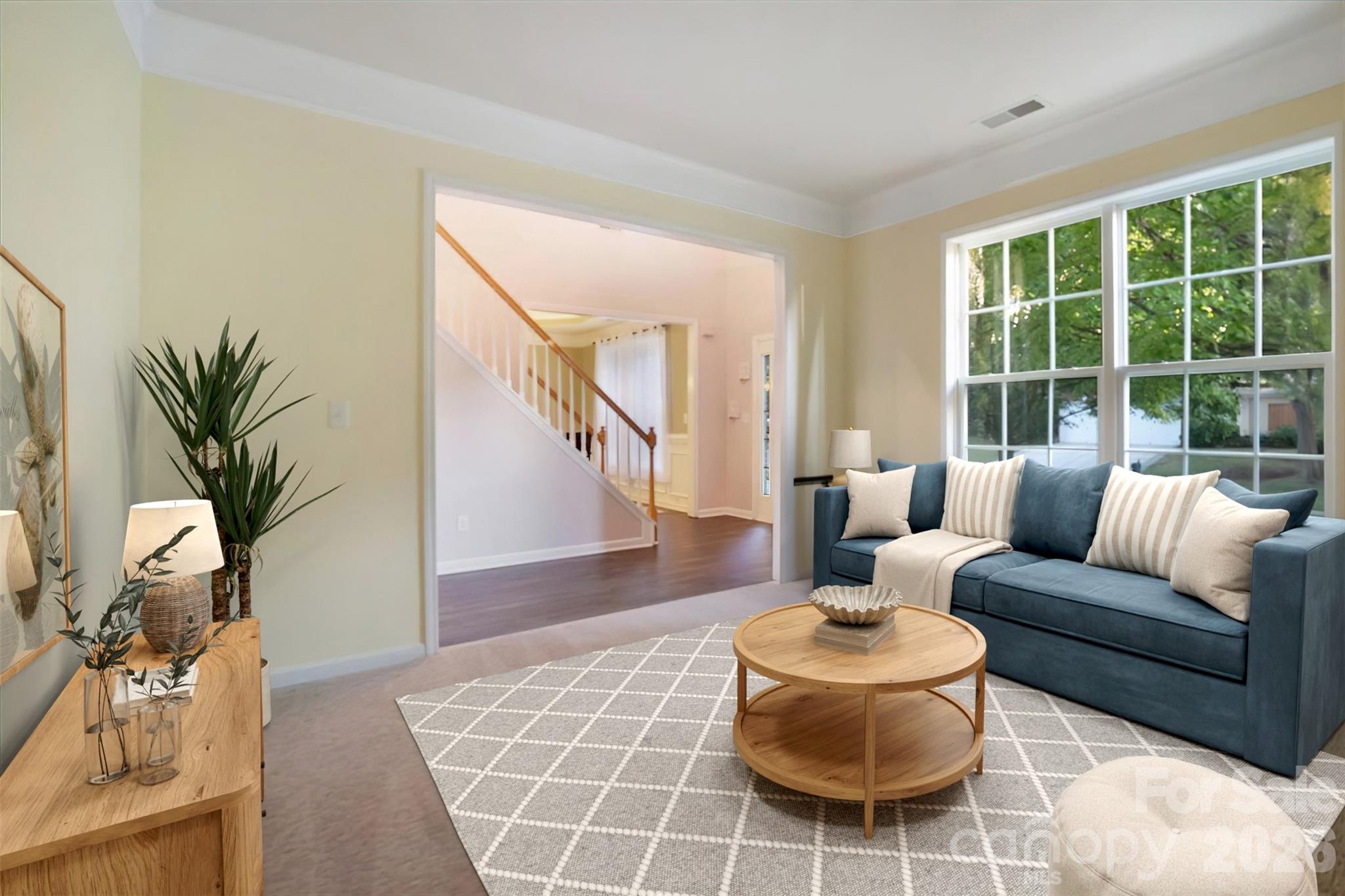 Warm inviting living room with crown molding. - 144 Steeplechase Avenue, Mooresville