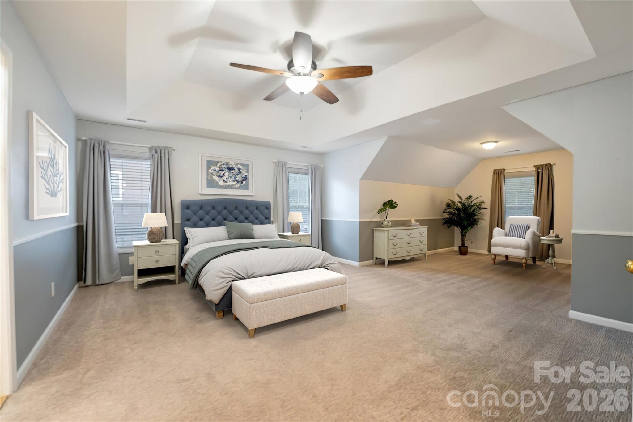Large primary bedroom with try ceiling. - 144 Steeplechase Avenue, Mooresville