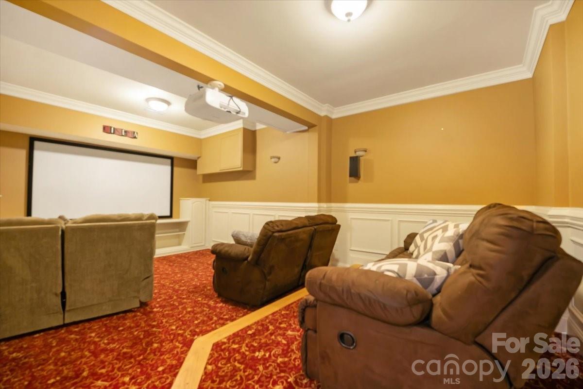 Media room designed for the perfect setting to watch and enjoy your favorite movie! - 144 Steeplechase Avenue, Mooresville
