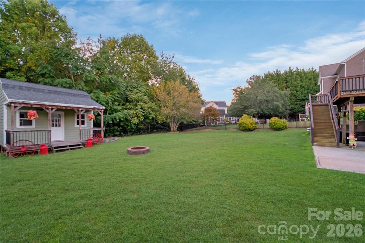 Backyard with fire pit for those crisp fall evenings. - 144 Steeplechase Avenue, Mooresville