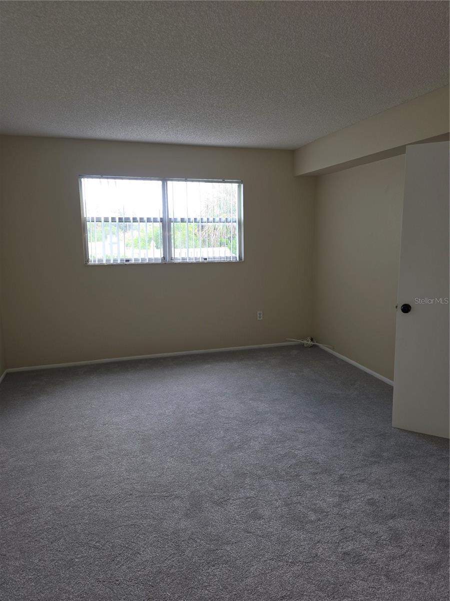 Primary Bedroom view from Primary Bathroom - 4140 PASSPORT LN #101, NEW PORT RICHEY