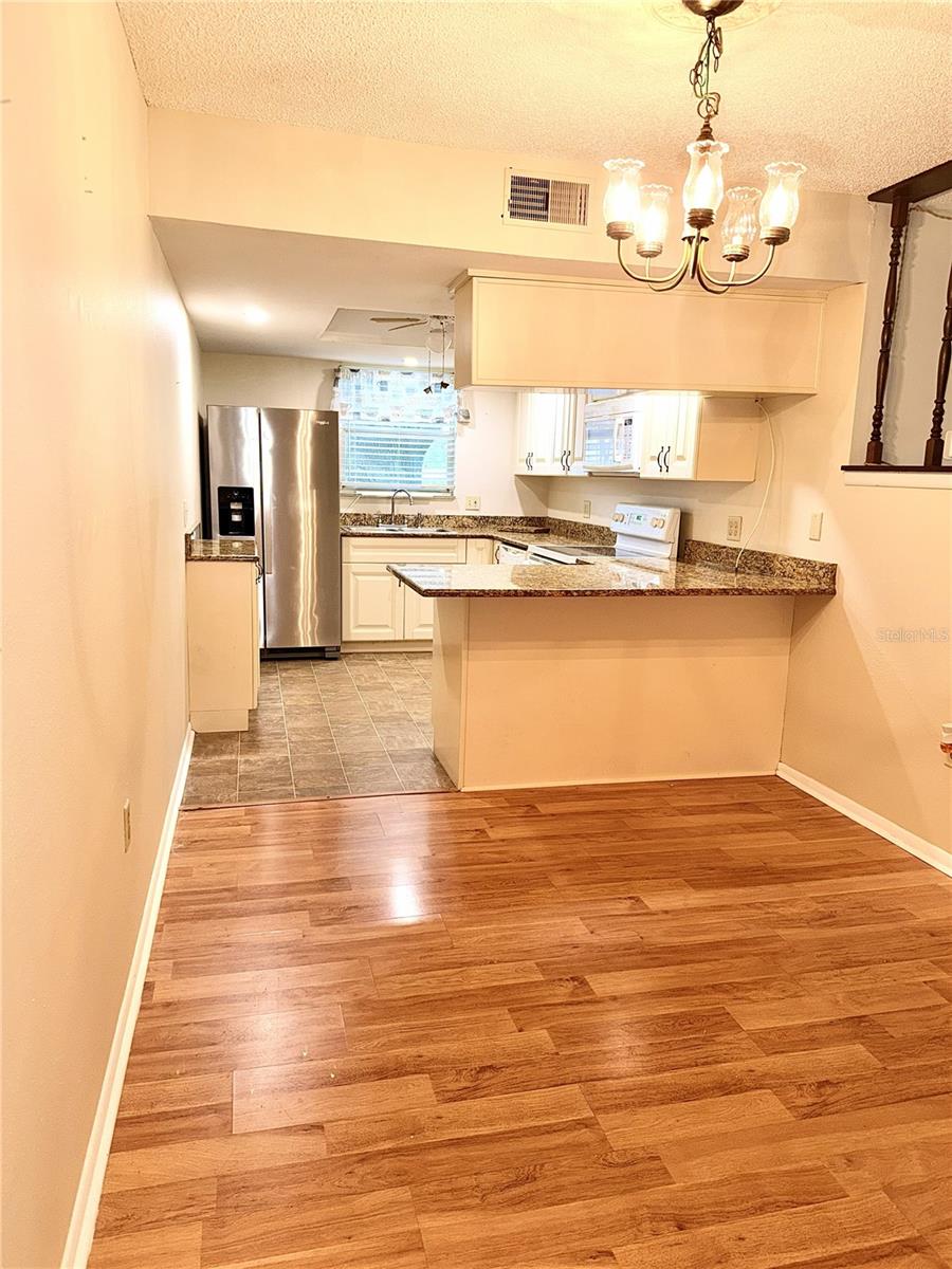 Freshly painted Kitchen and dinning room combo - 4140 PASSPORT LN #101, NEW PORT RICHEY