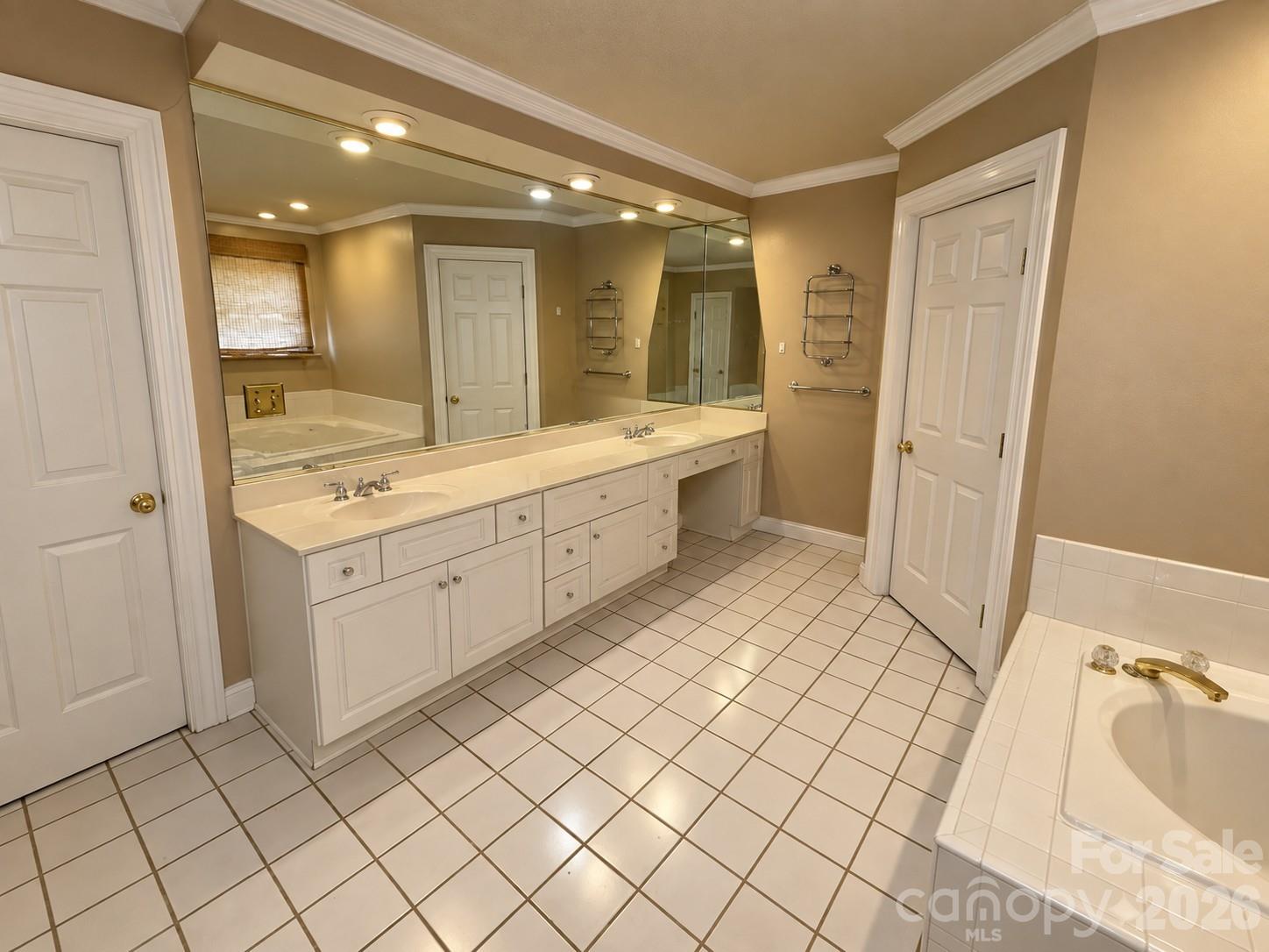 Beige Bathroom with Mirrored Vanity - 4711 Summit Avenue, Greensboro