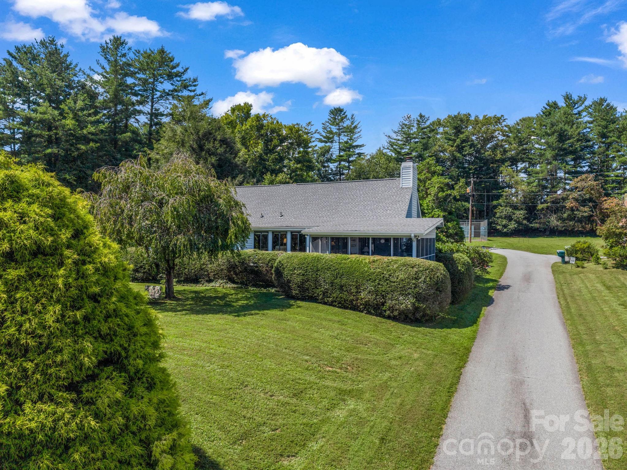 Driveway to home, end townhome unit, oversized 2 car garage with storage - 31 Willow Way, Hendersonville