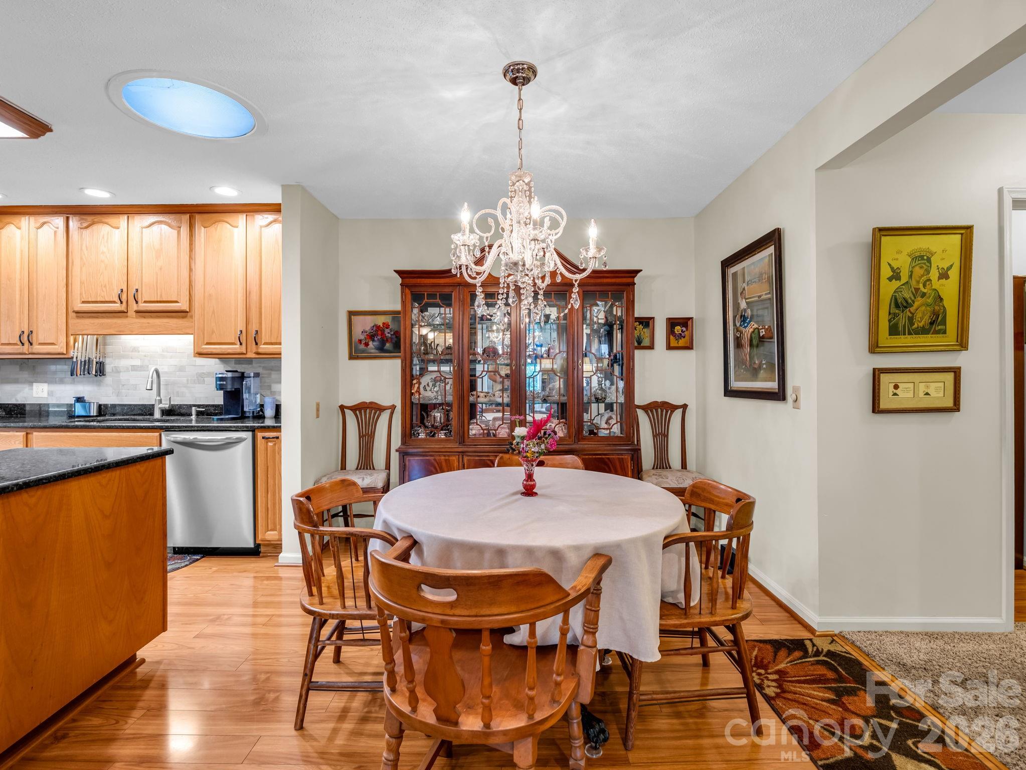 Dining room, kitchen to the left, hall leading to bedrooms to the right - 31 Willow Way, Hendersonville