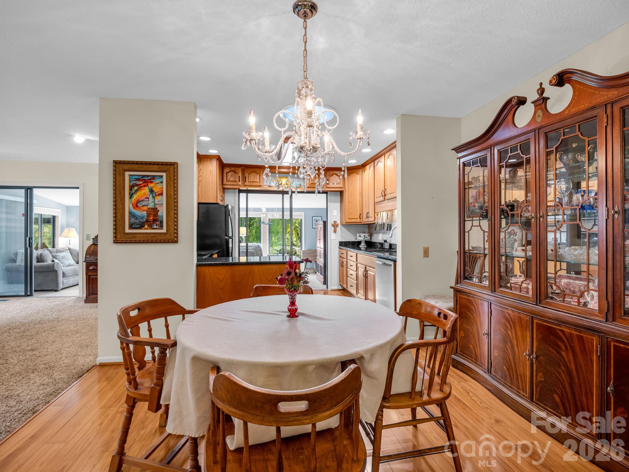 Looking from hallway into dining room and kitchen, living area to the left - 31 Willow Way, Hendersonville