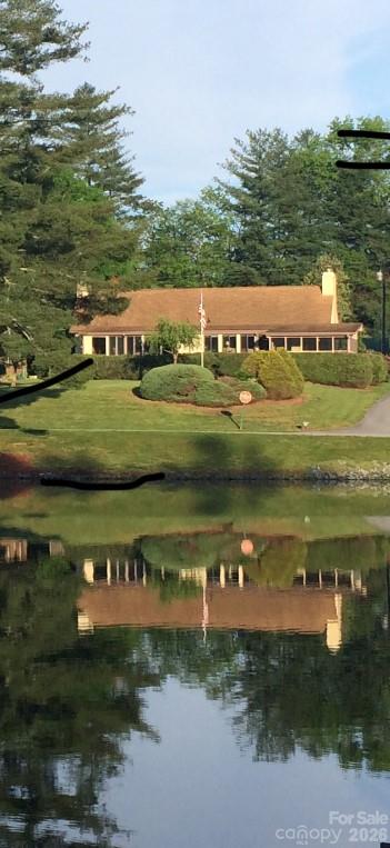 Photo of the home from across the lake - 31 Willow Way, Hendersonville