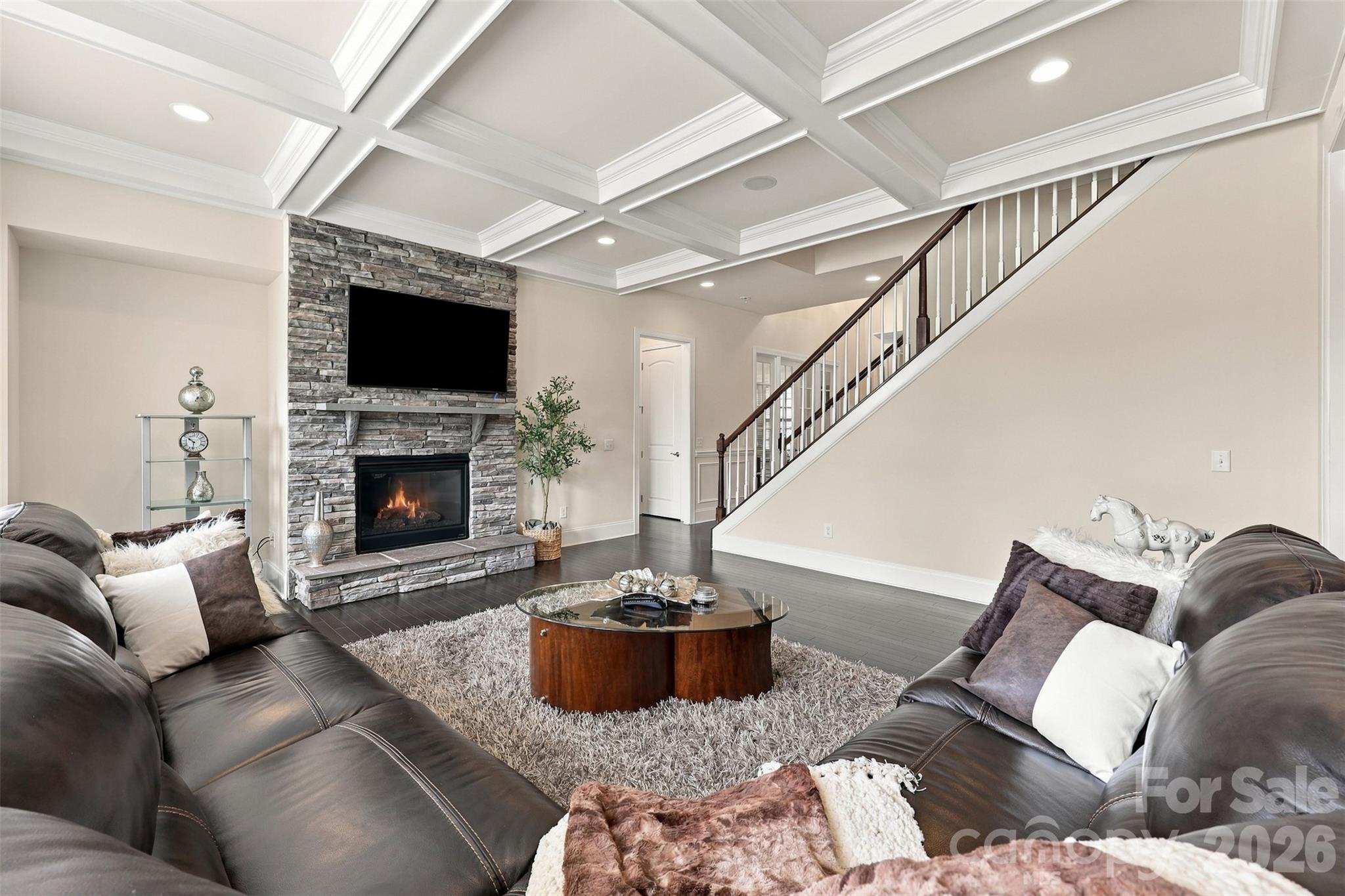 living room coffered ceiling, stone fireplace, sonos surround sound - 131 Reserve Lane, Indian Land