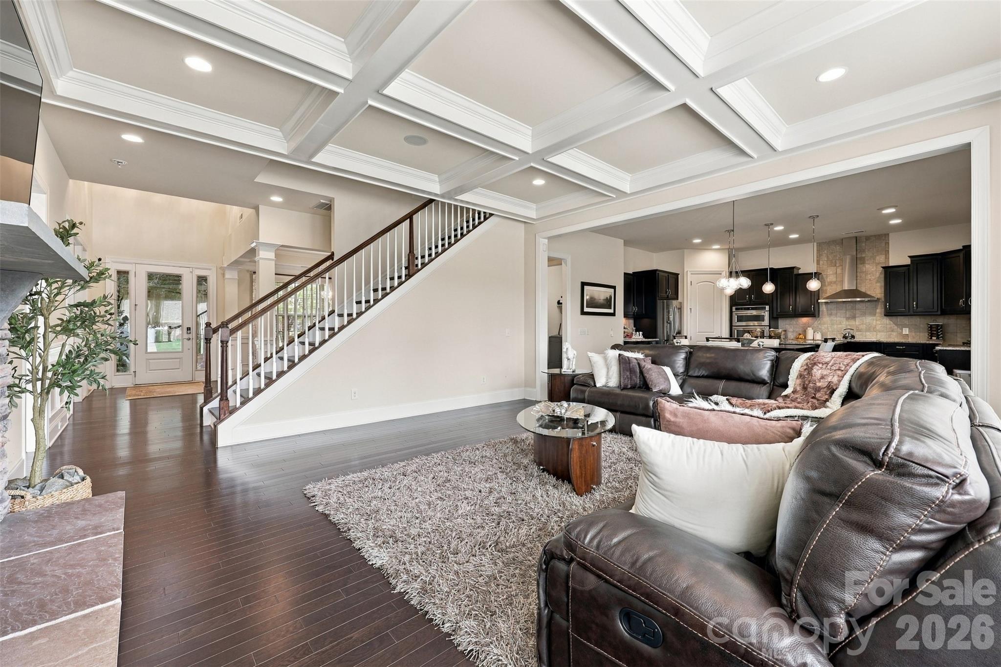 living room, coffered ceiling, stone fireplace, sonos surround sound - 131 Reserve Lane, Indian Land